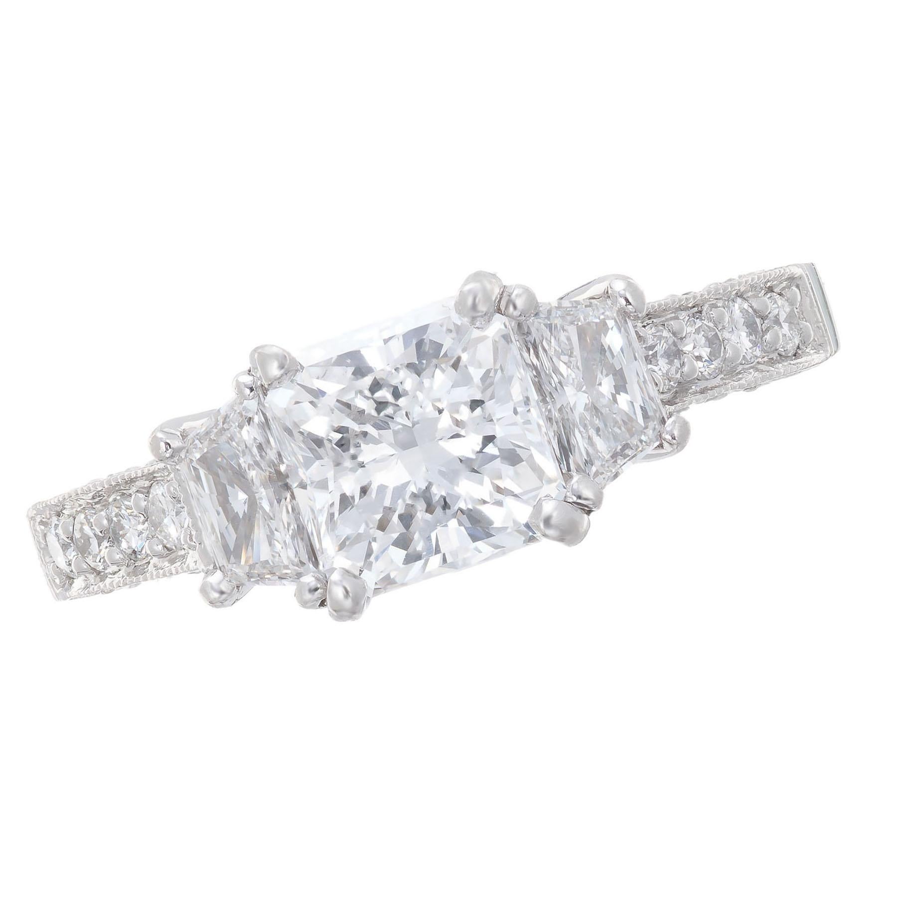 Original Martin Flyer Diamond Platinum three-stone Engagement ring. GIA certified center radiant cut diamond with 2 trapezoid side diamonds. Pave set diamonds along the shoulders and sides. 

1 radiant cut 1.22cts, diamond¸I1, F, VS2. GIA