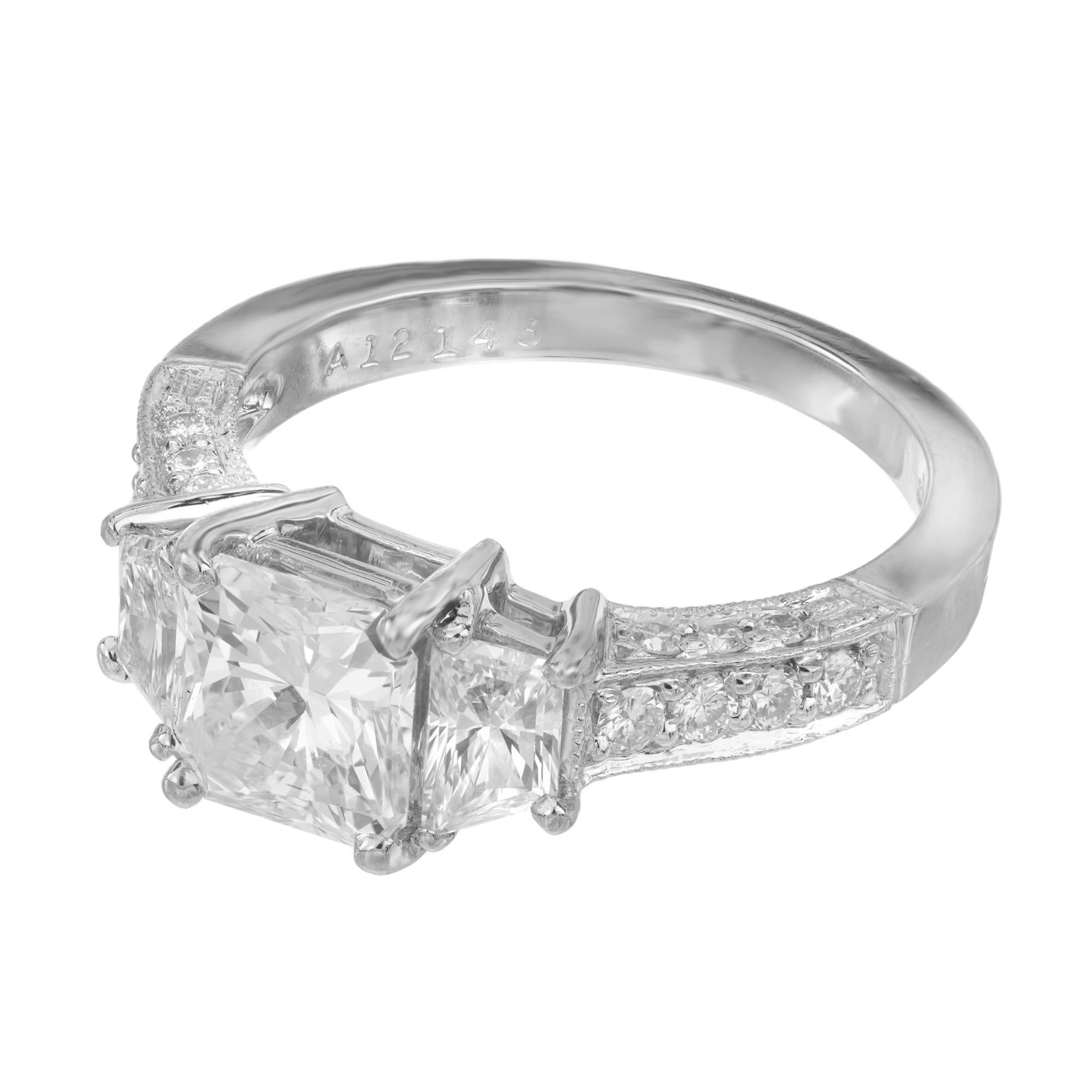 Original Martin Flyer Diamond Platinum three-stone Engagement ring. Set with a GIA certified center radiant cut diamond with a total weight of 1.22cts, graded as near colorless. Accented with 2 trapezoid side diamonds. The shoulders and sides of the
