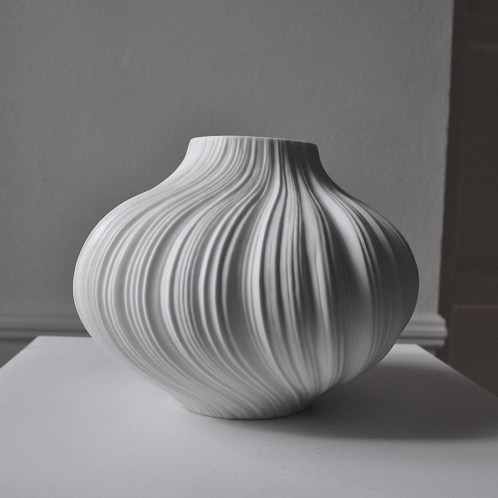 Vessel. Various one of a kind shapes available.

Made in Germany by Martin Freyer for Rosenthal

Materials: White unglazed porcelain exterior with glazed porcelain interior

   

Elegant unglazed matte white pleated detail porcelain vase