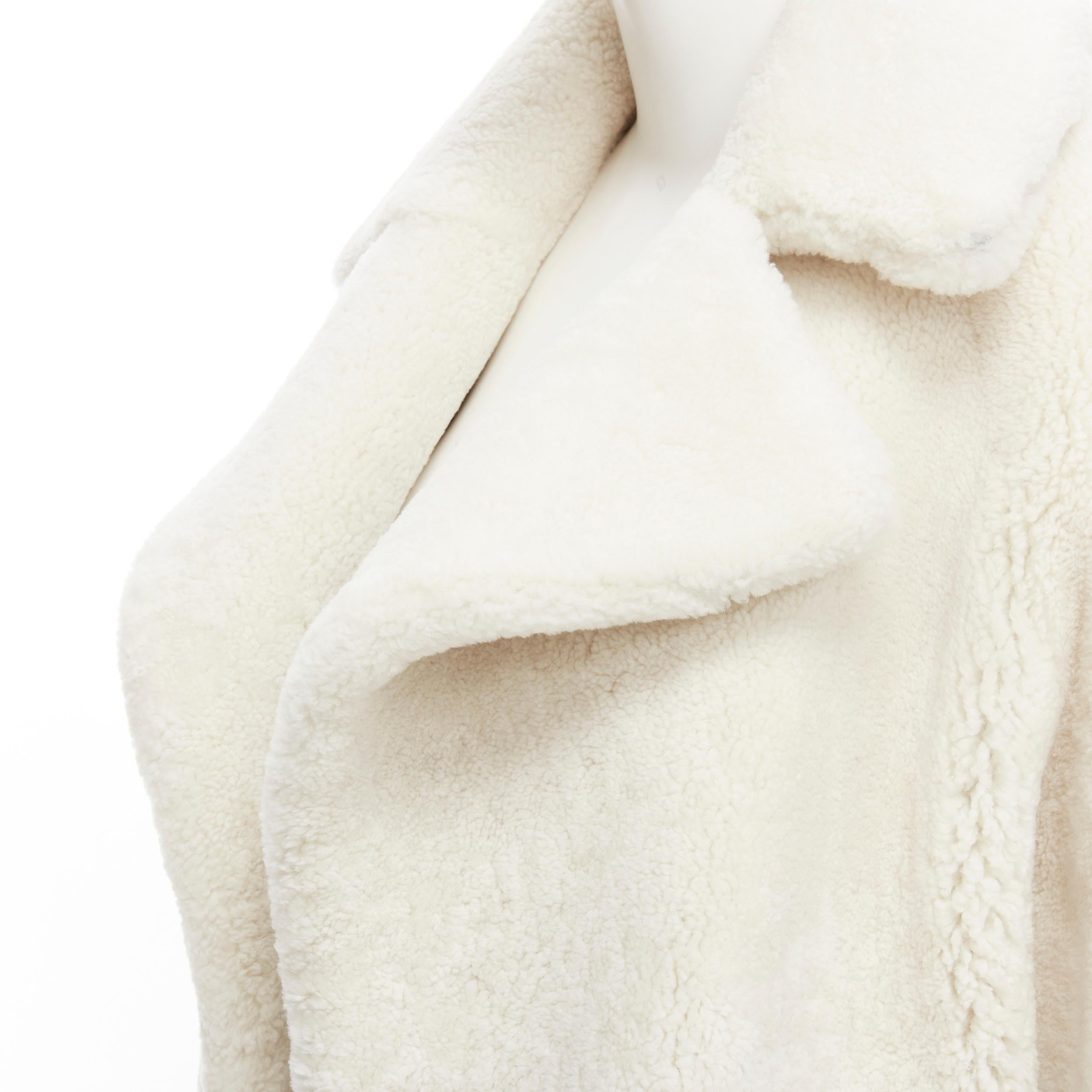 MARTIN GRANT 100% lambskin shearling white oversized Teddy winter coat FR36 S 
Reference: LNKO/A01843 
Brand: Martin Grant 
Designer: Anya Hindmarch 
Material: Lambskin 
Color: White 
Pattern: Solid 
Extra Detail: Open front. Dual slit pockets.