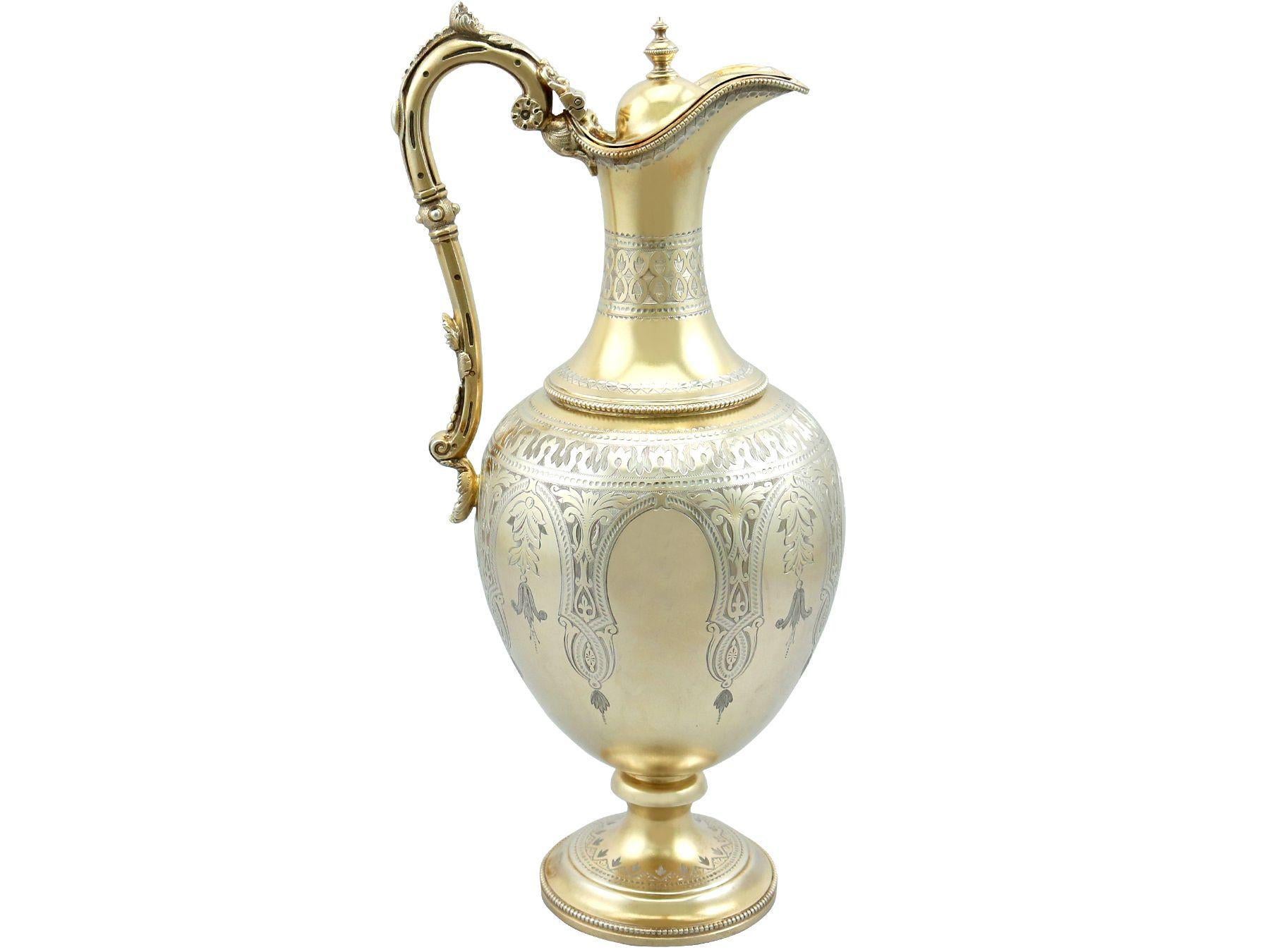 An exceptional, fine and impressive antique Victorian English sterling silver claret jug with matching goblets; an addition to our range of wine and drinks related silverware.

This exceptional Victorian sterling silver parcel gilt set consists of a