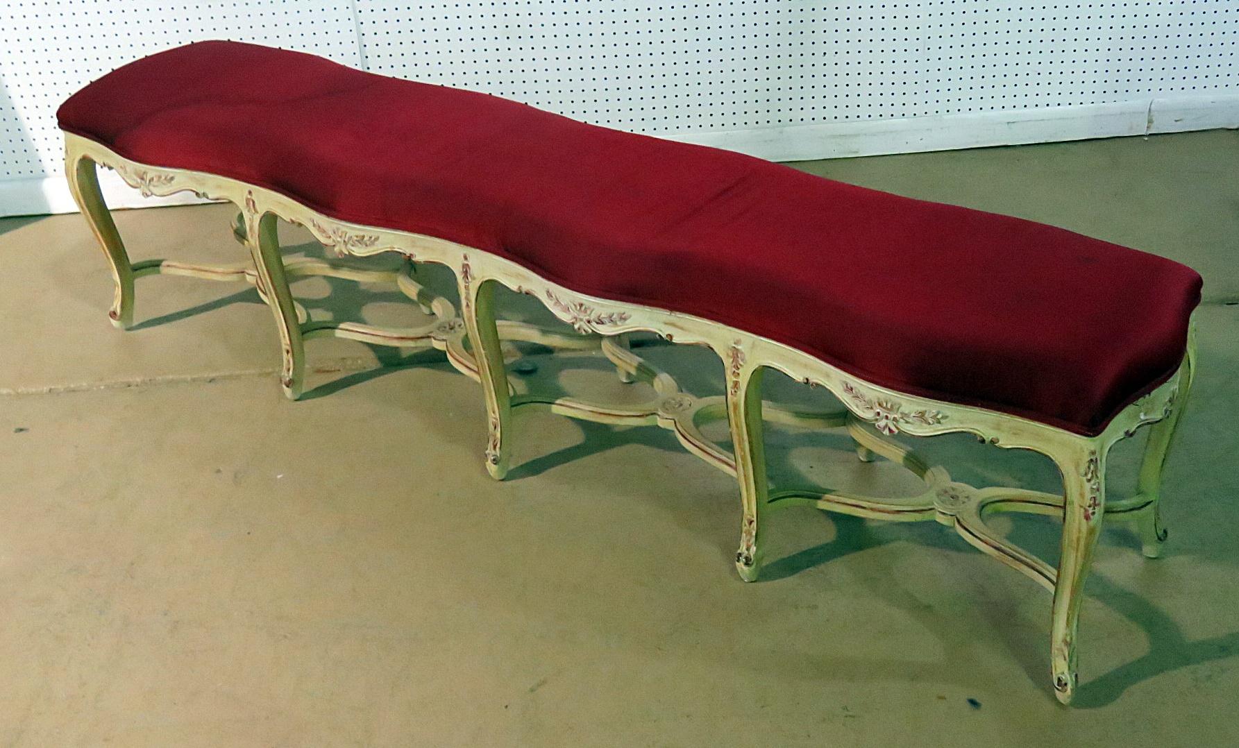 This is a rare and unusual 10 legged French Louis XV bench. Perfect for use at the foot of a bed or by a window, this extremely long bench can also be used in a hallway or virtually anywhere a unique and special piece is necessary. Surely you