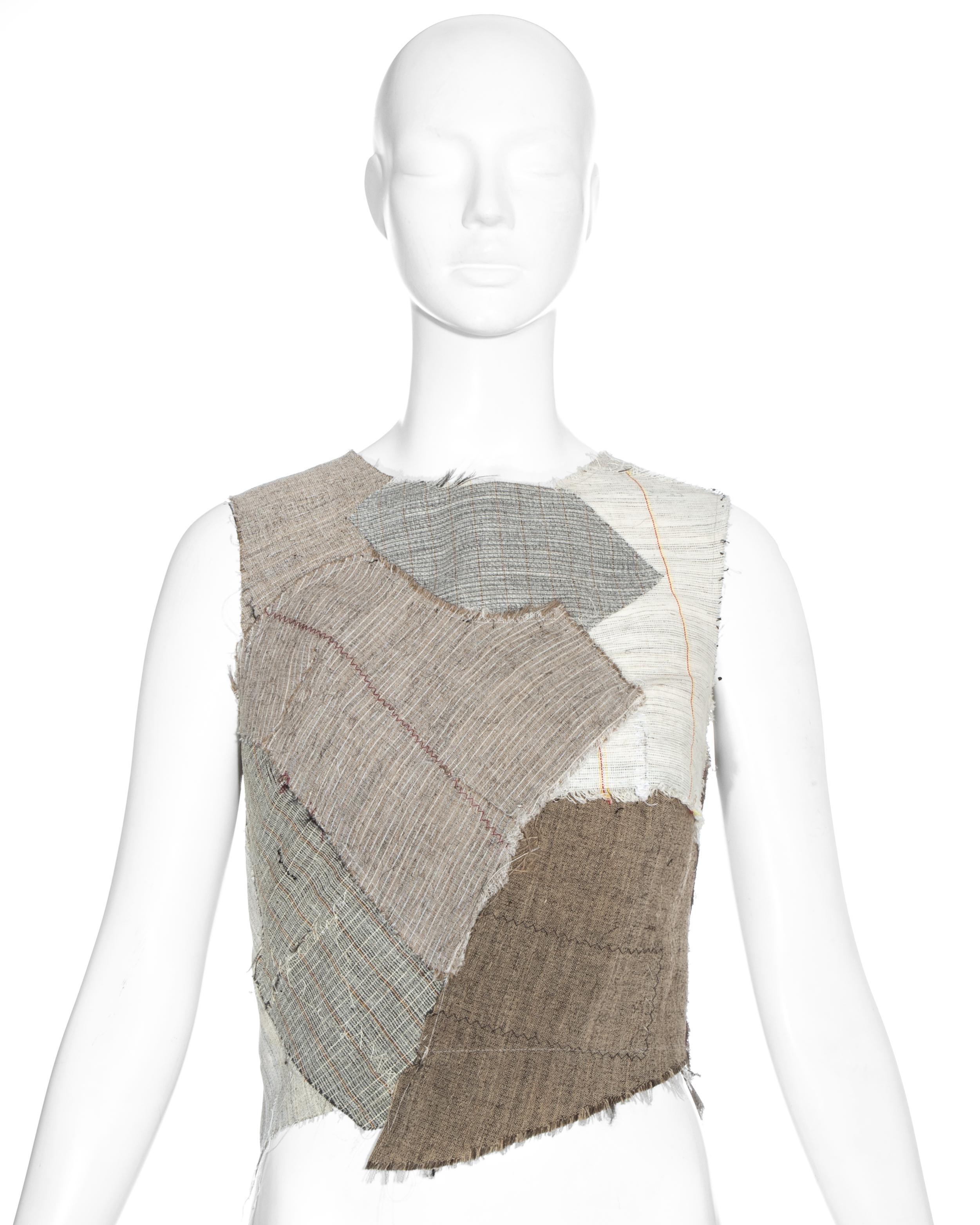 Martin Margiela artisanal corset top made with a patchwork of tailoring linen canvases backed in cream cotton. 

Fall-Winter 2003