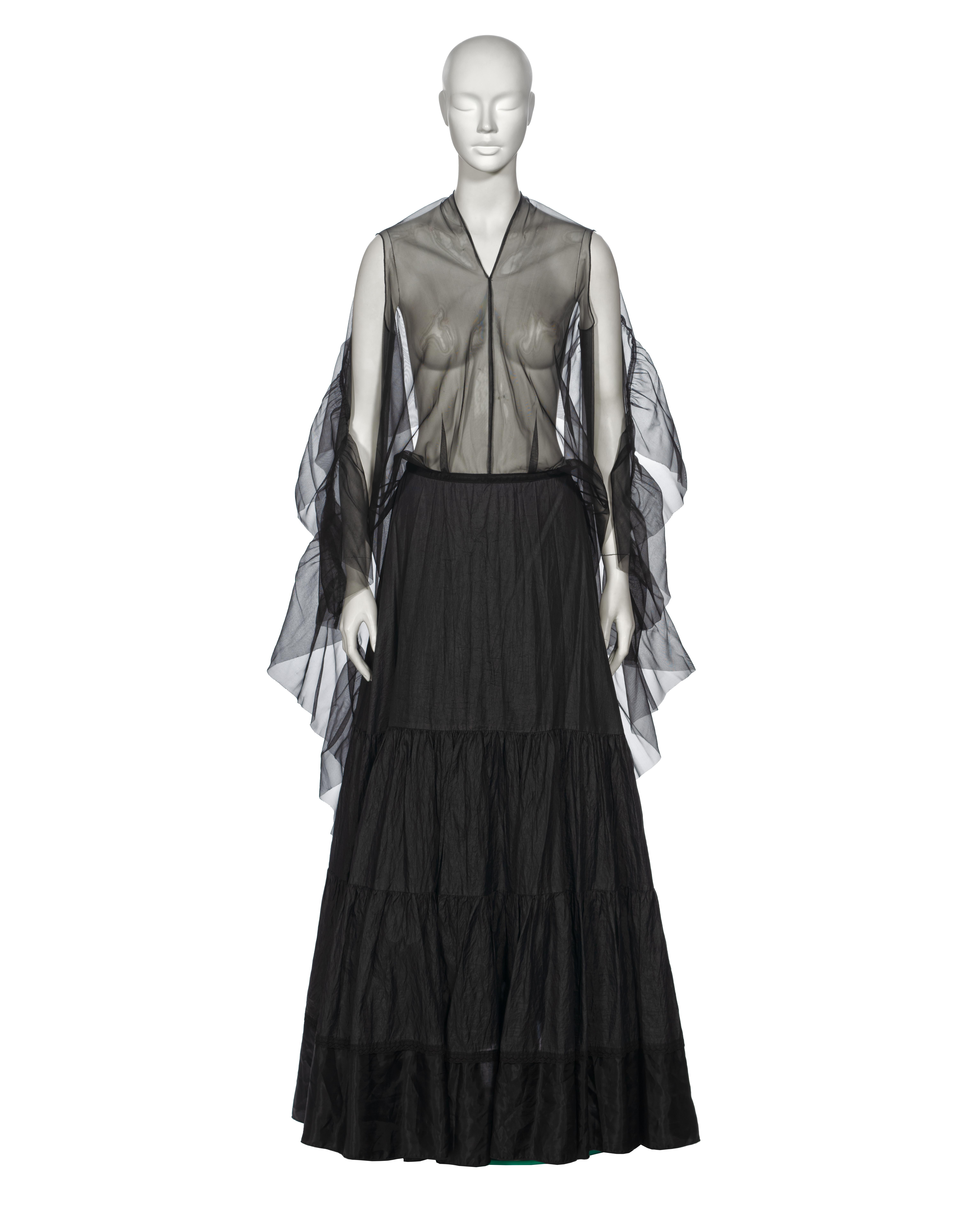 ▪ Archival Margiela Evening Dress
▪ Creative Director: Martin Margiela 
▪ Spring-Summer 2003
▪ Sold by One of a Kind Archive
▪ Museum Grade 
▪ Constructed from repurposed vintage petticoats
▪ The outer skirt showcases tiered pleated panels in