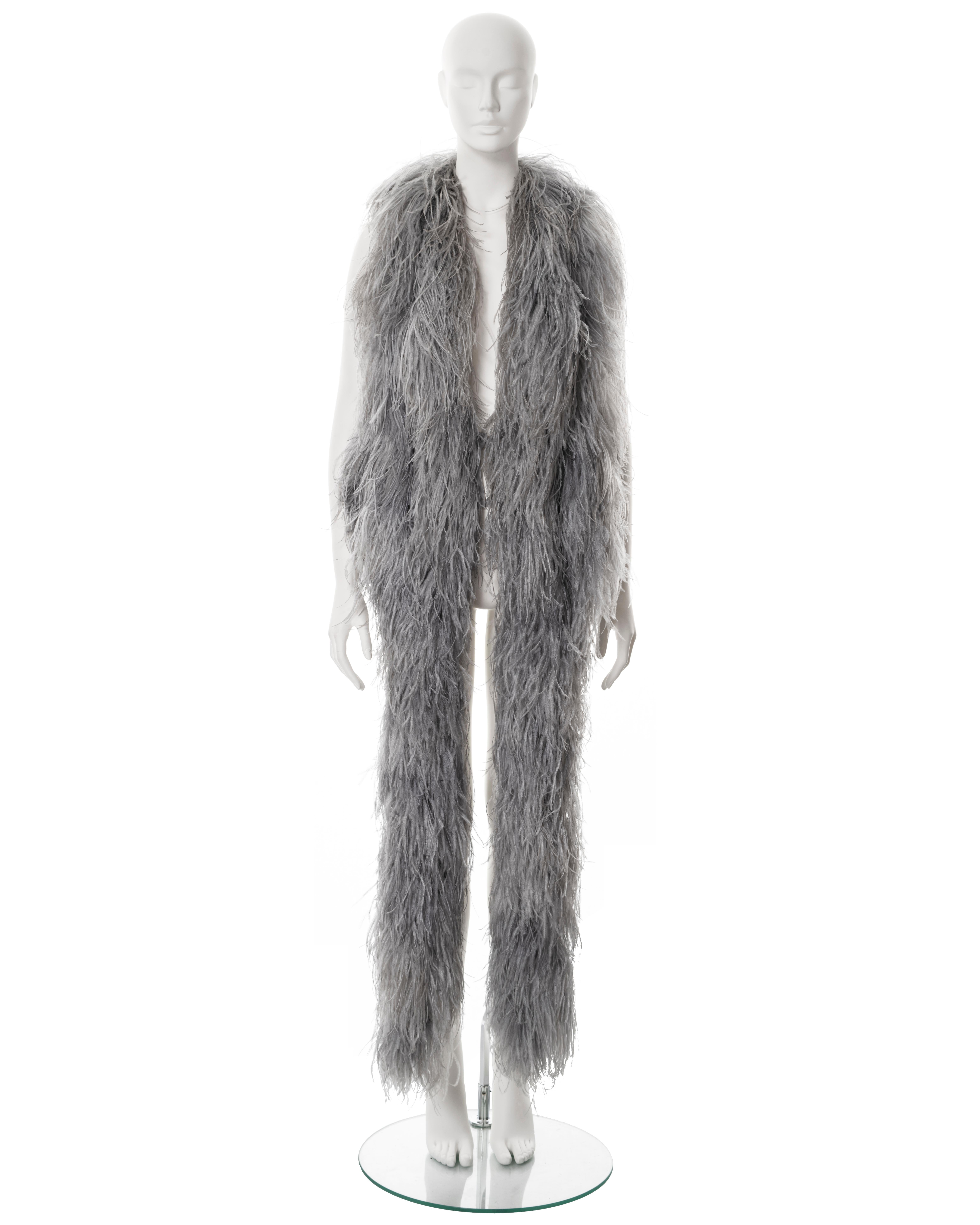 ▪ Martin Margiela artisanal waistcoat
▪ Sold by One of a Kind Archive
▪ Fall-Winter 2004
▪ Constructed from several grey ostrich feather panels 
▪ Built-in waistcoat with hook fastenings 
▪ Longer front 
▪ Open at the back exposing the back of an
