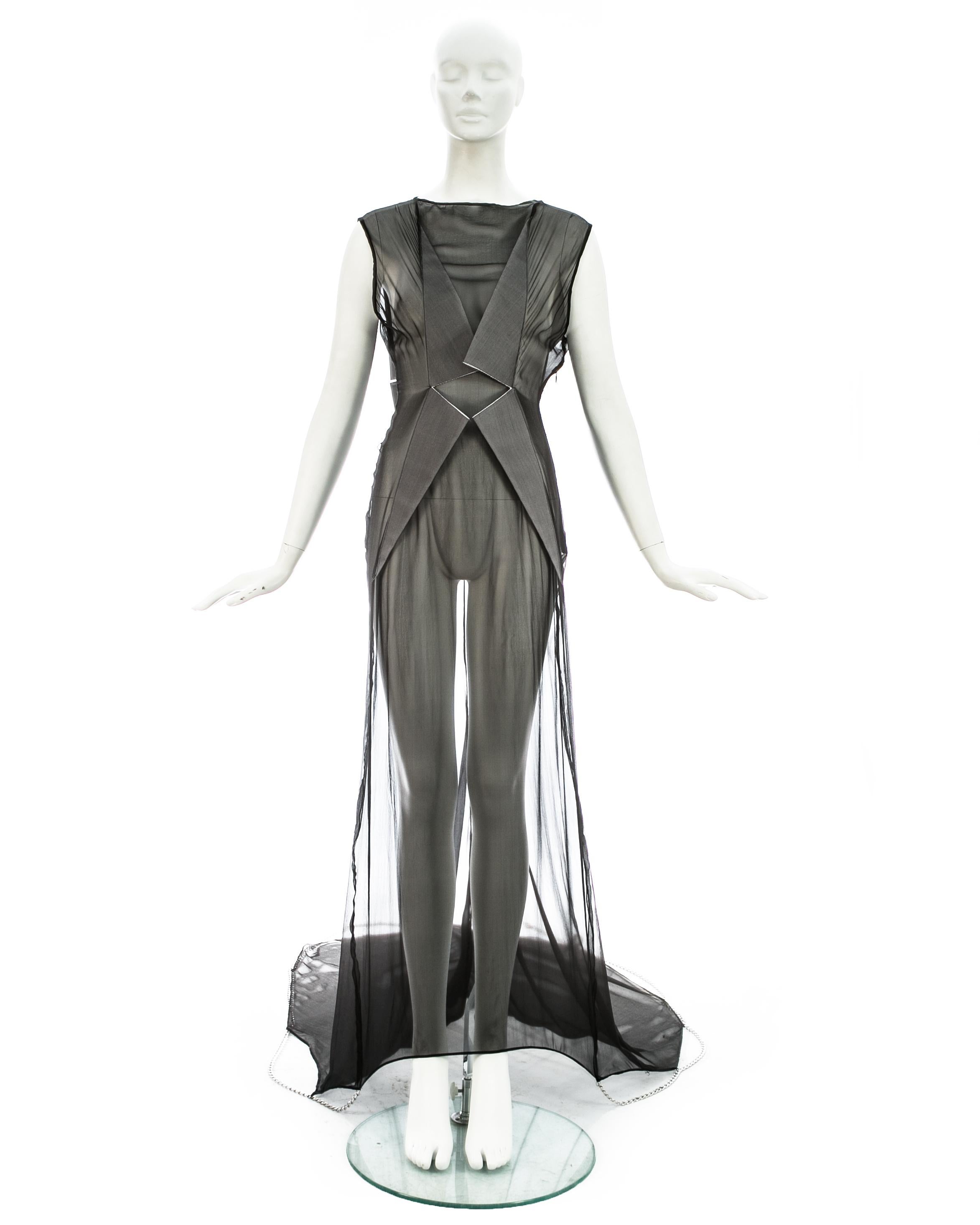 Margiela; Black silk chiffon full length evening gown with metal chain hem and lapels on back and front. The train can be brought up with a button fastening on the side seam. 

Spring-Summer 2010