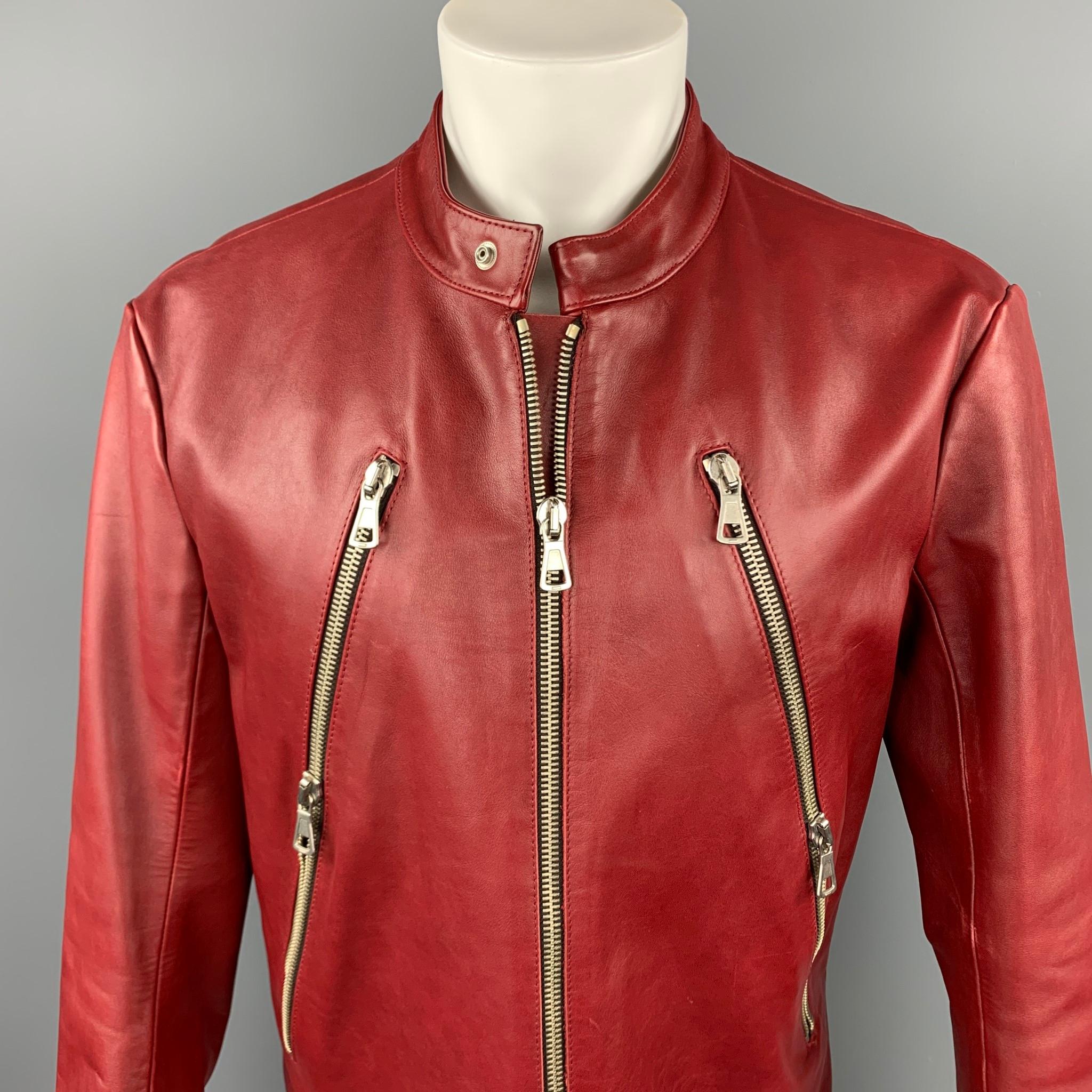 MARTIN MARGIELA jacket comes in a brick red leather featuring a motorcycle style, front zipper pockets, zipper sleeves, buttoned collar, armpit hole details, and a zip up closure. Mino wear. Made in Italy.

Very Good Pre-Owned Condition.
Marked: No