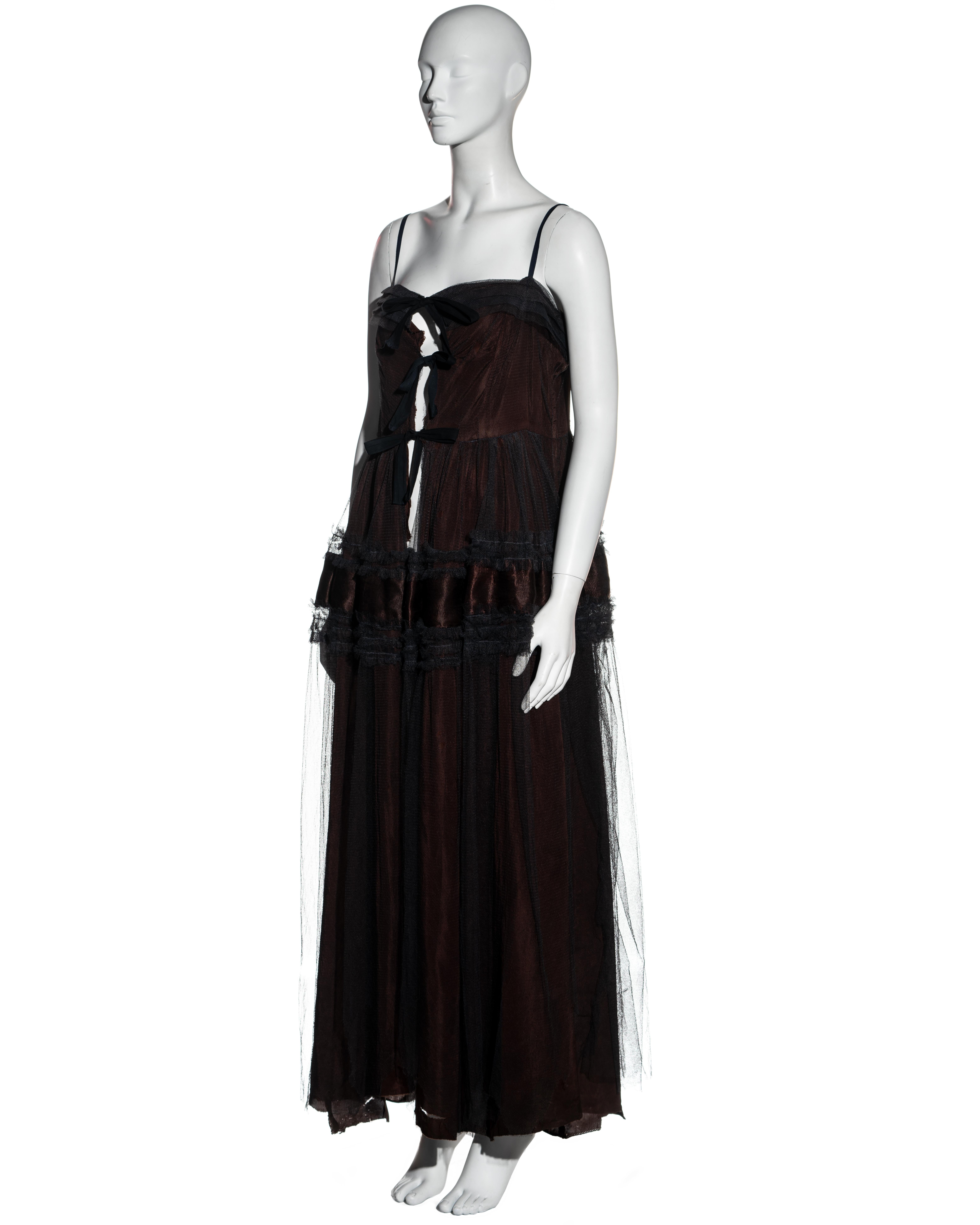 ▪ Martin Margiela full length waist coat 
▪ Made from a recycled 1950's ballgown with slit down the front 
▪ 3 black ties at the front 
▪ Metal zipper at side seam 
▪ Pleated and ruffled details on bodice and skirt 
▪ 