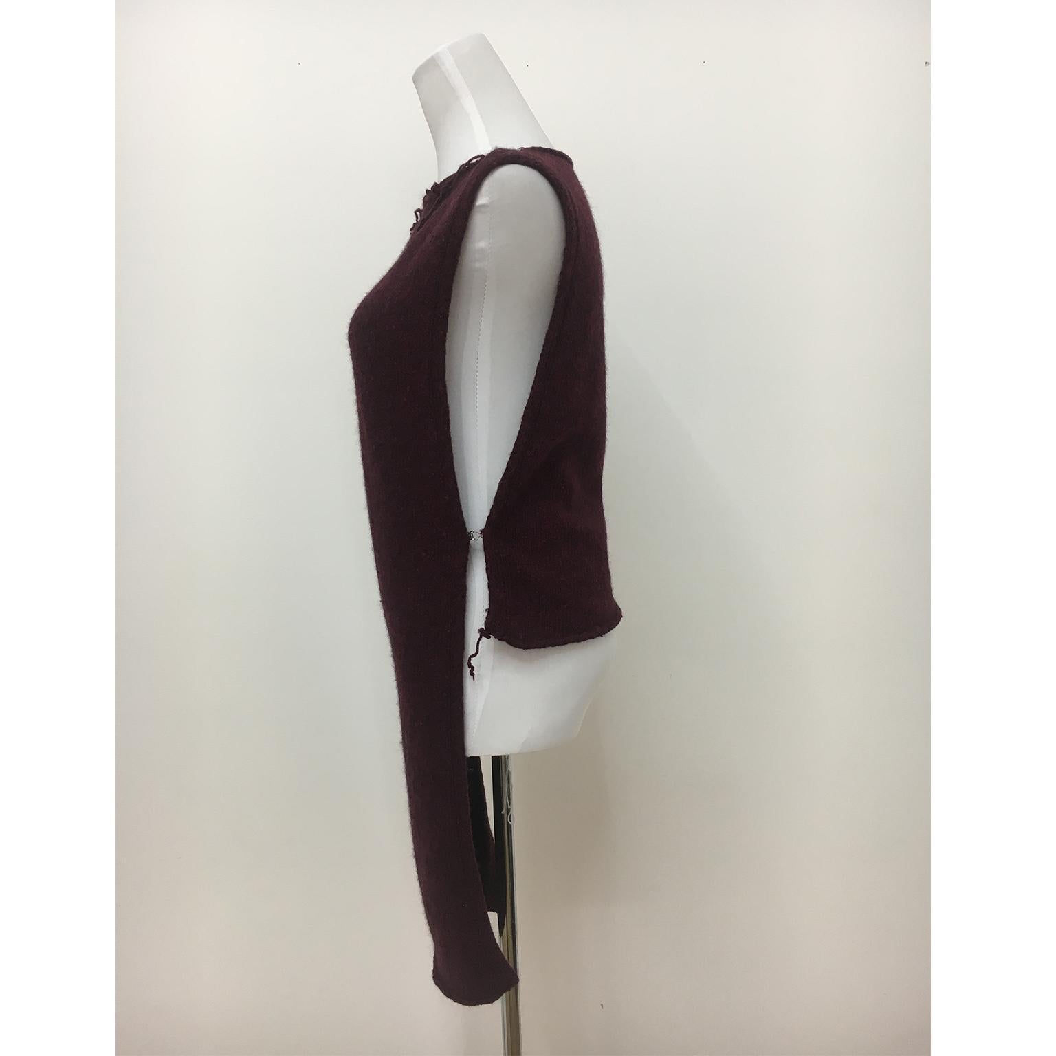 Maison Martin Margiela knit body piece from circa 2000.
Destroyed neck line, side open with hooks. One size.