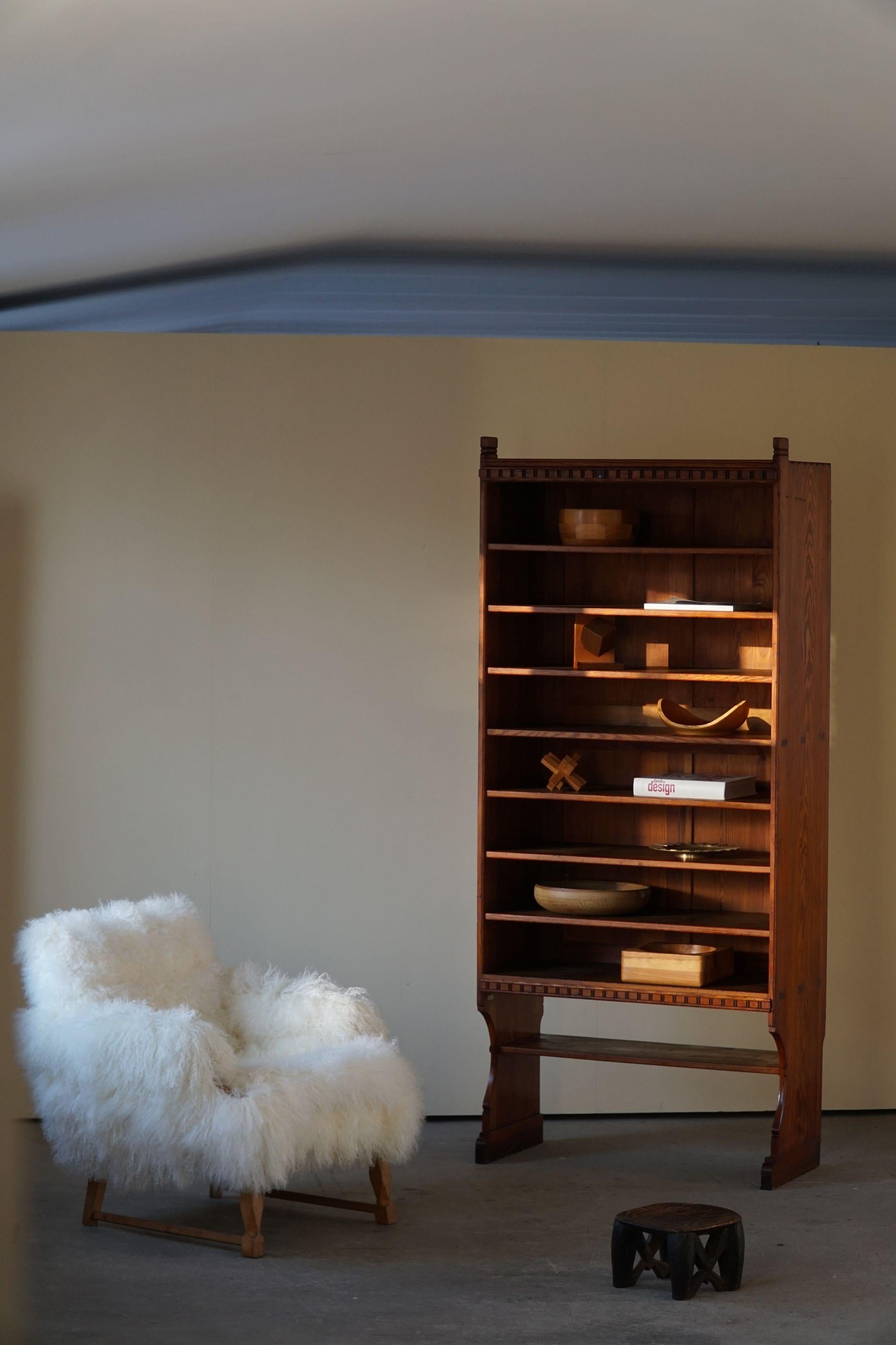 Rare tall bookcase in oregon pine by Danish architect Martin Nyrop (1849-1921) for cabinetmakers Rud. Rasmussen in 1905.
These cabinets were designed for Copenhagen City hall as a custom made project, therefore this is a unique opportunity to
