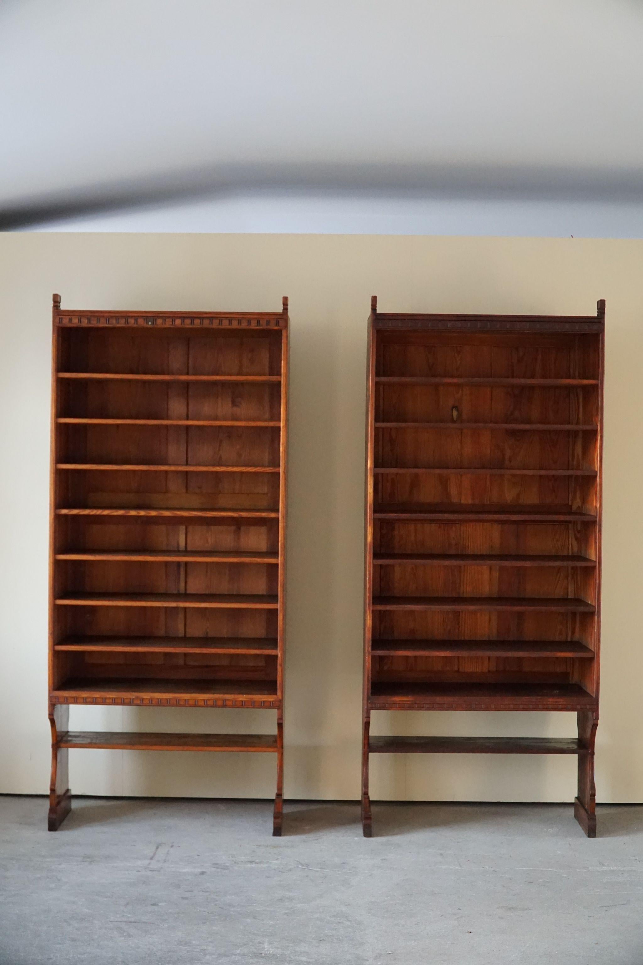 Rare tall pair of bookcases in oregon pine by Danish architect Martin Nyrop (1849-1921) for cabinetmakers Rud. Rasmussen in 1905.
These cabinets were designed for Copenhagen City hall as a custom made project, therefore this is a unique opportunity