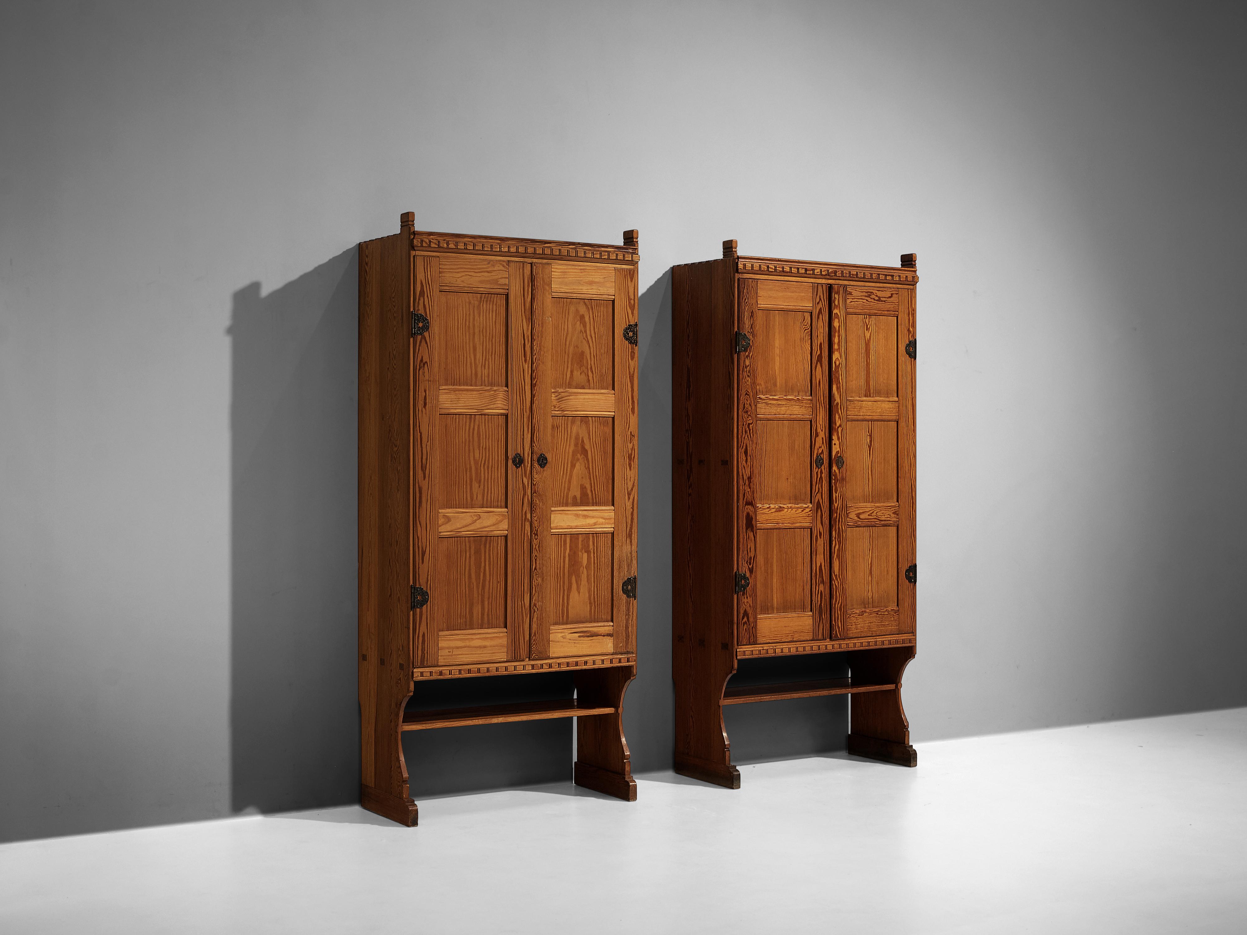 Martin Nyrop for Rud Rasmussen, cabinets model '6433', pine, metal, Denmark, designed around 1905 

Graceful cabinets by Danish architect Martin Nyrop. Nyrop designed them for the Copenhagen City Hall which was completed in 1905. He was the head