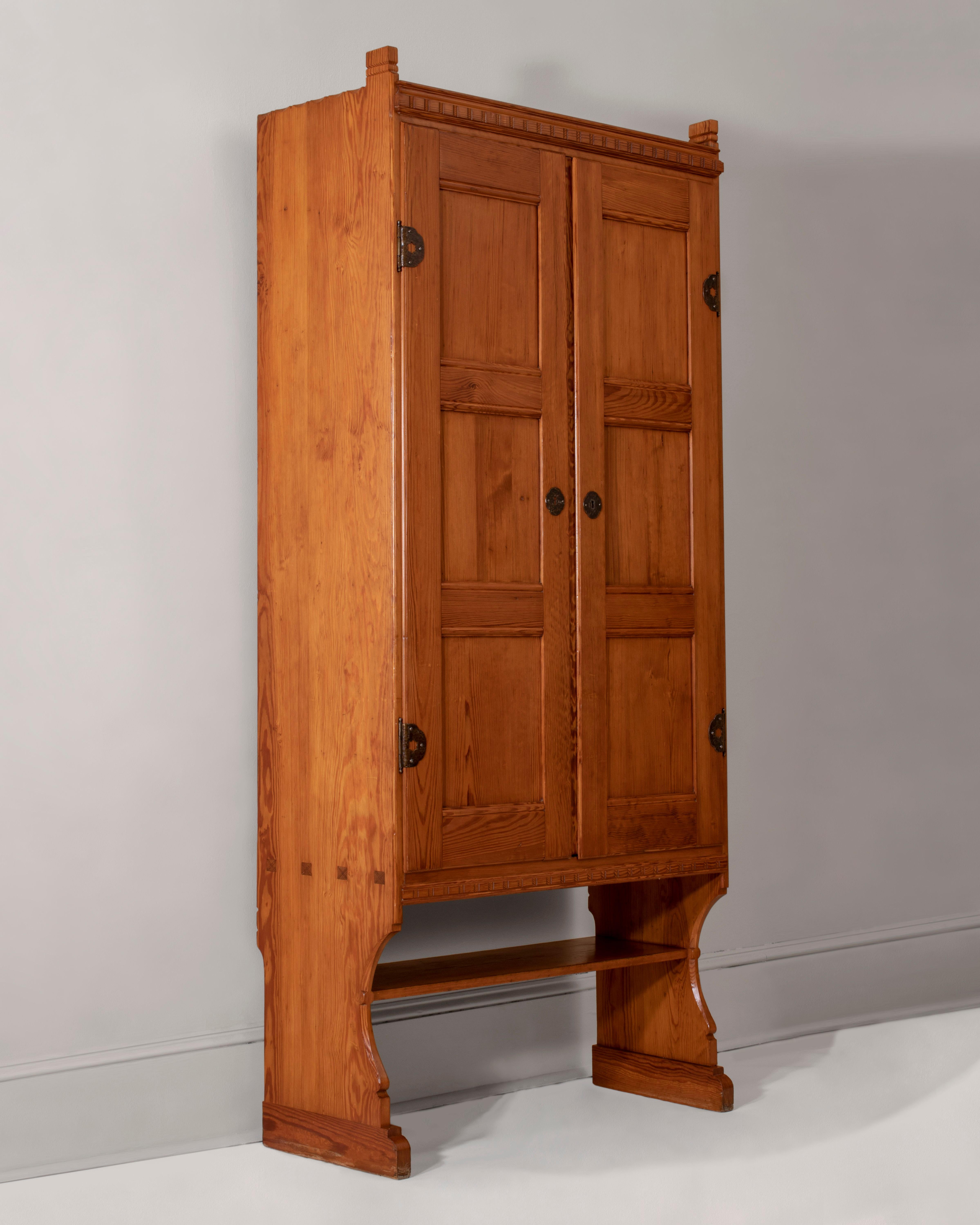 Martin Nyrop for Rud. Rasmussen, Pair of Danish Iron Mounted Pine Cabinets In Good Condition In Philadelphia, PA