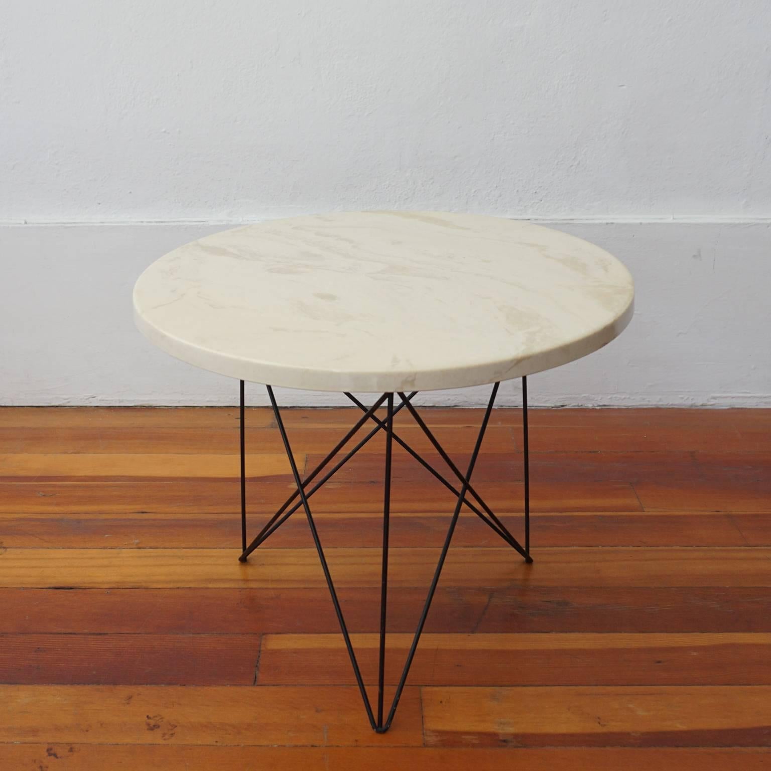 Criss-cross tripod base with marble-top side table by Martin Perfit for Rene Brancusi Inc, 1950s.