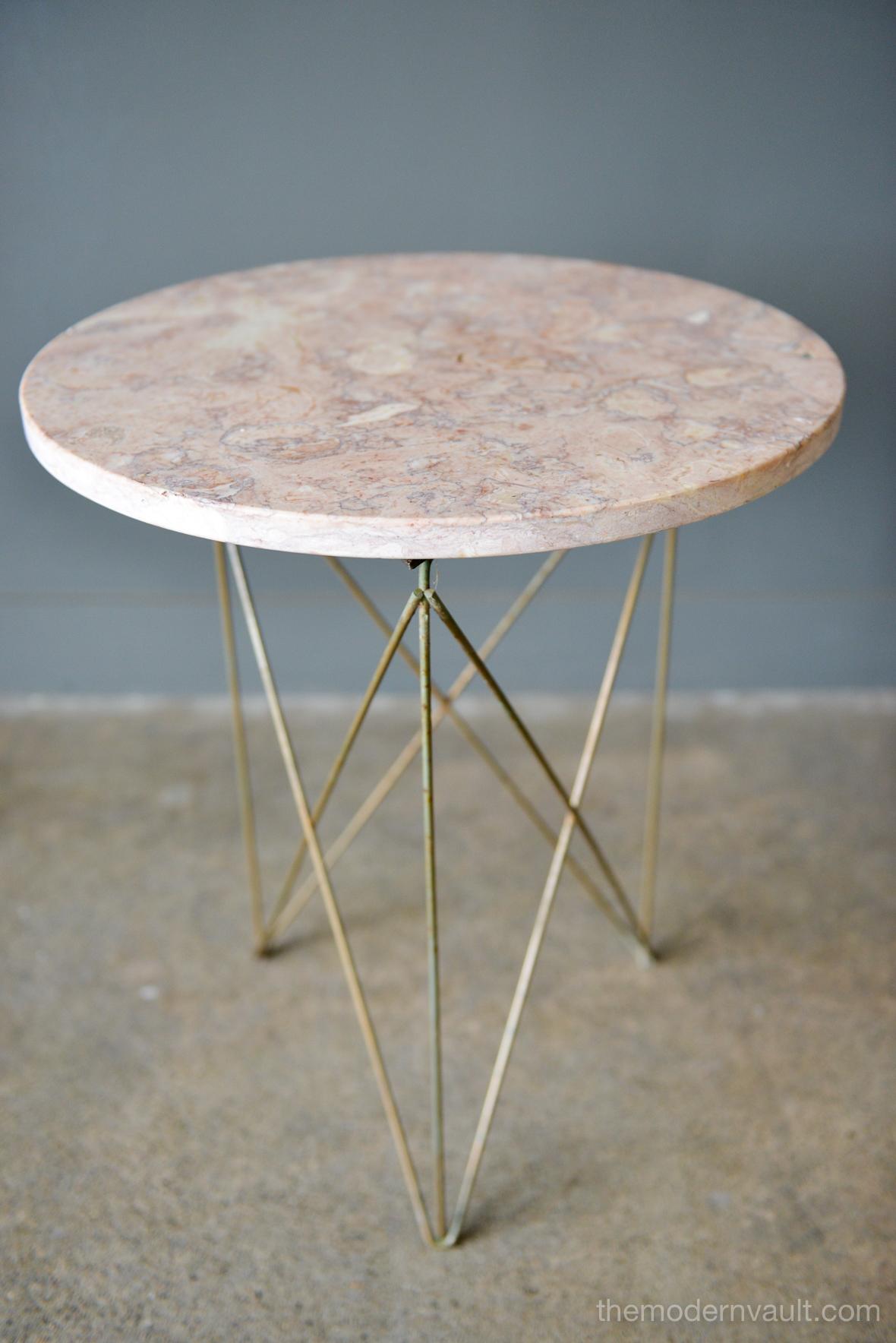 Martin Perfit for Rene Brancusi terrazzo stone and brass occasional table, circa 1955. Polished pink terrazzo with brass rod strut base, circa 1955. Good vintage condition with age appropriate patina to brass rods. Small natural imperfection in the