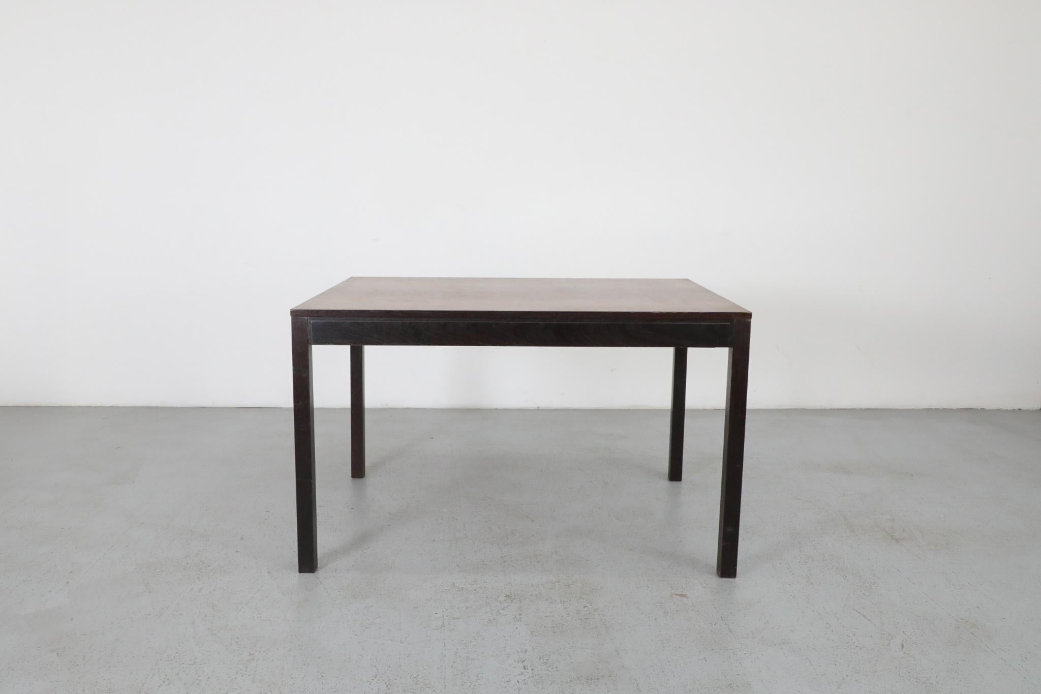 Small extendable Wenge dining table with original darker leaf. Very cool two-toned look when extended. Unique telescoping extension. Would pair nicely with a set of Wenge and rush dining chairs, see LU922439855762.

Leaf: 19.75 x 33.5
Width with