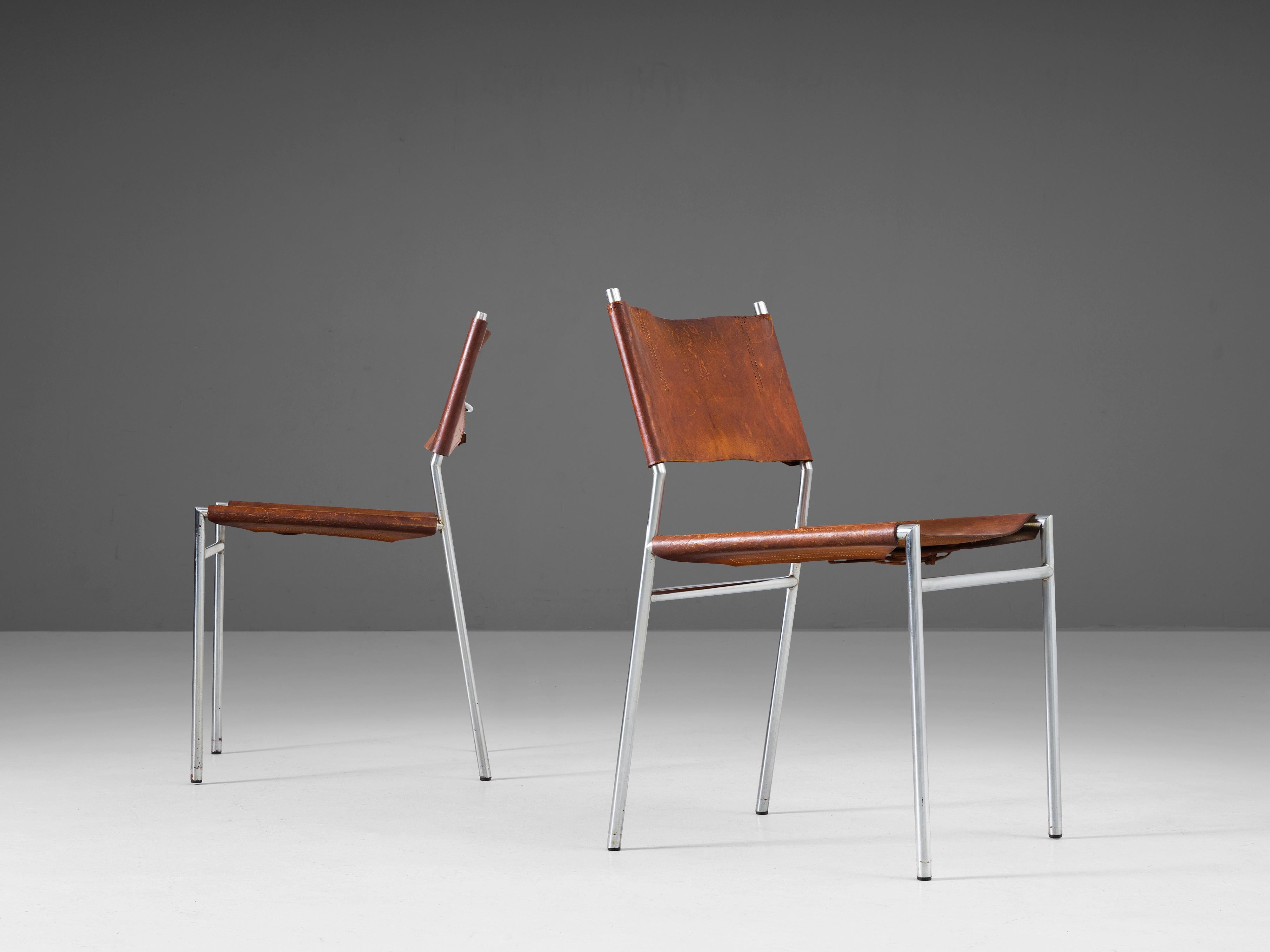 Martin Visser for 't Spectrum, pair of dining room chairs, steel and leather, the Netherlands, 1960s.

Pair of cognac leather dining chairs. The designs of Martin Visser characterize by clear lines and the use of metal in combination with natural