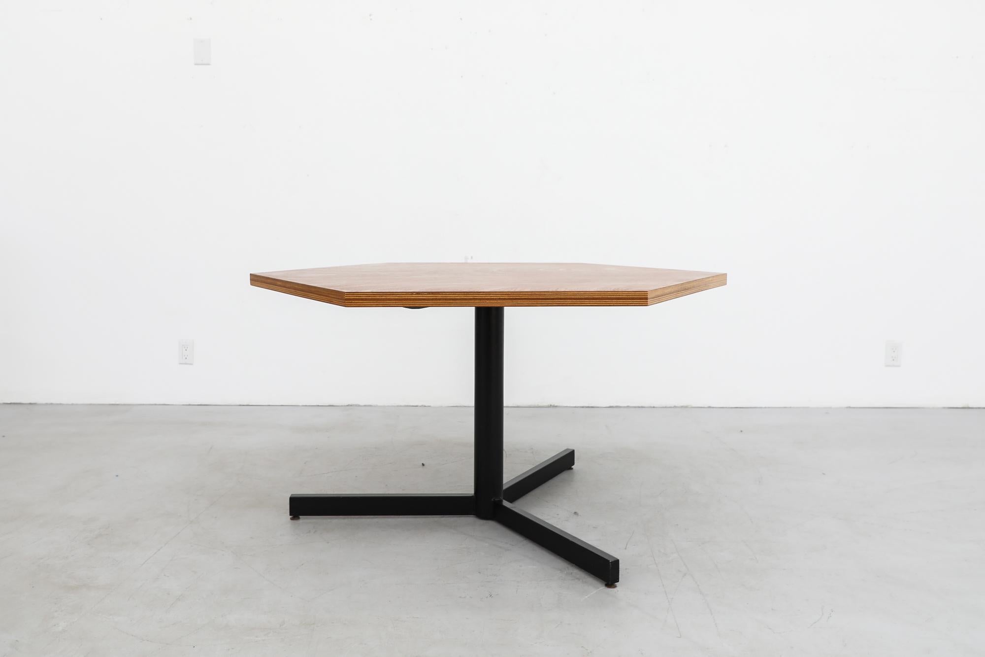 Martin Visser inspired midcentury center or dining table with pedestal black enameled base and walnut hexagon top. The striking shape of the top is also reminiscent of Charlotte Perriand's Pentagonal table design for Les Arcs. In good original