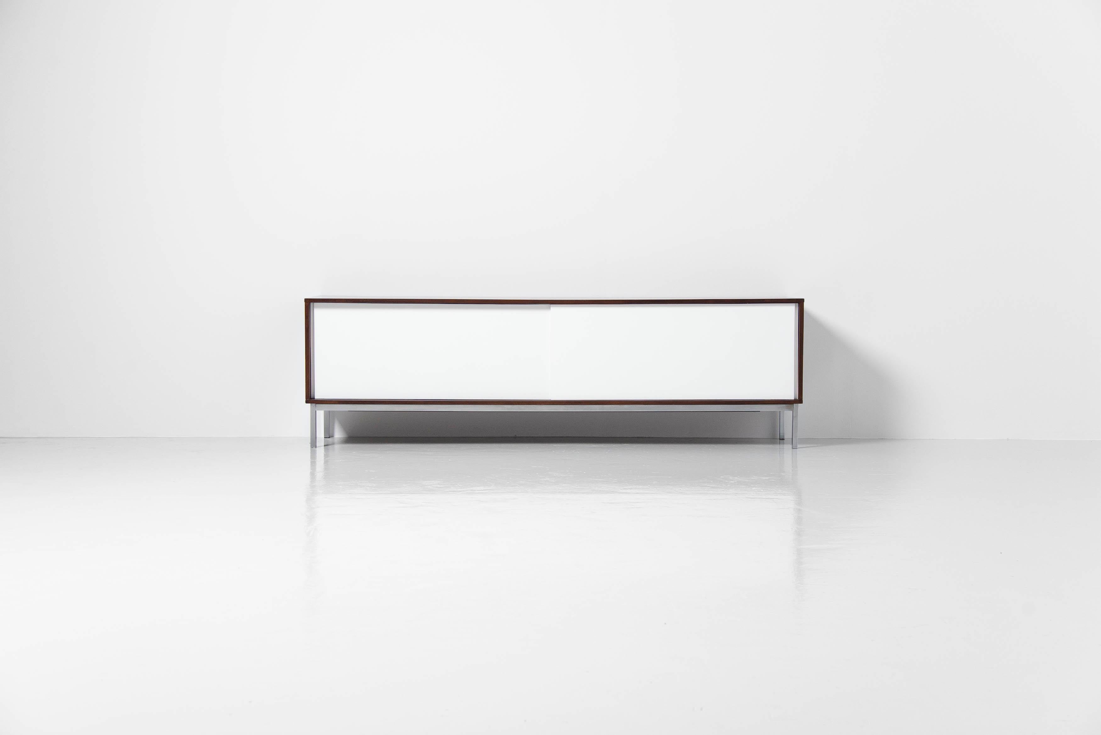 This is for a fantastic minimalist sideboard designed by Martin Visser and manufactured by ‘t Spectrum Bergeijk, produced between 1965 and 1971. The sideboard is in wenge wood and has white painted doors, with a matt chrome plated metal square