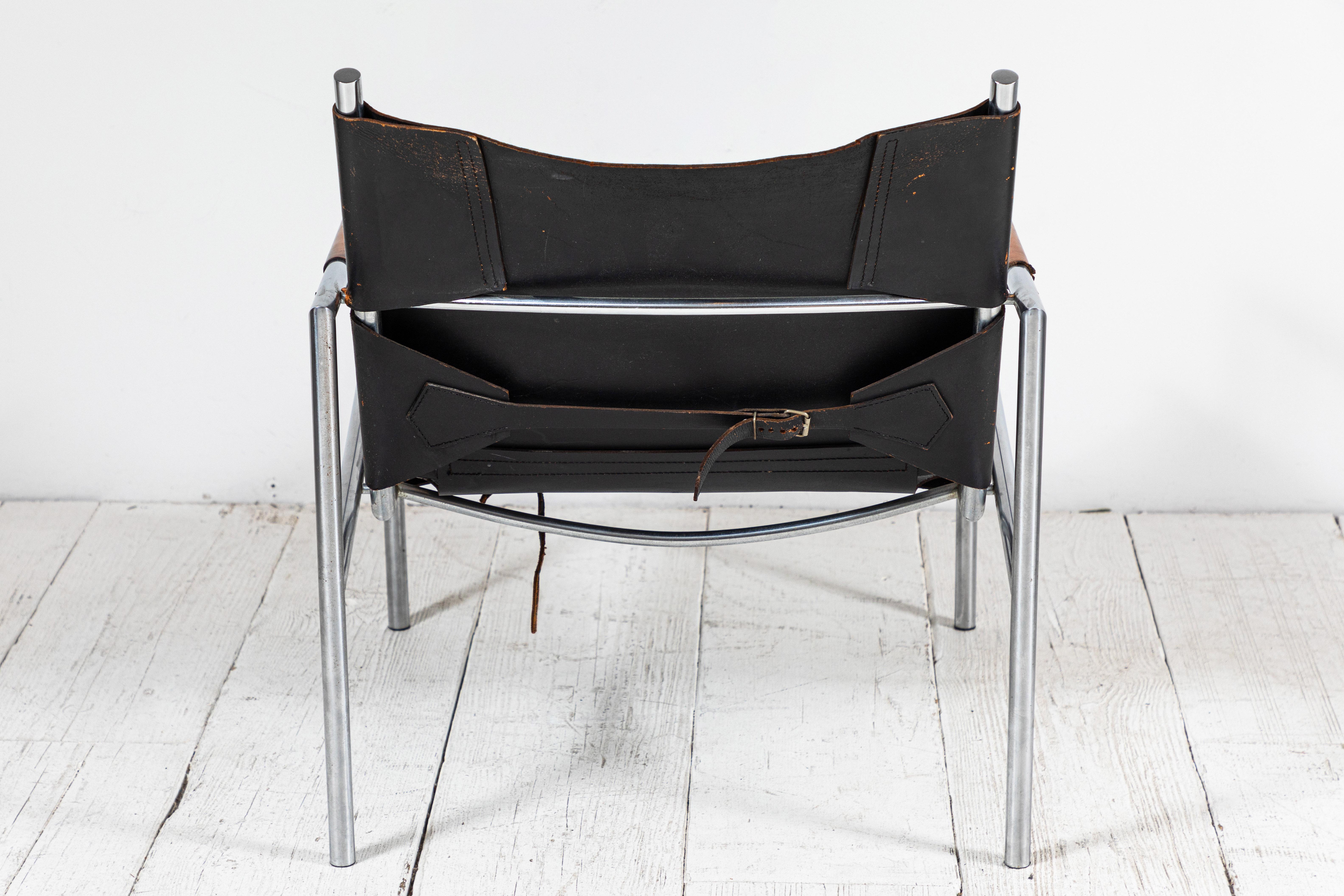 Martin Visser leather and chrome easy chair. The black leather is beautifully worn and aged.