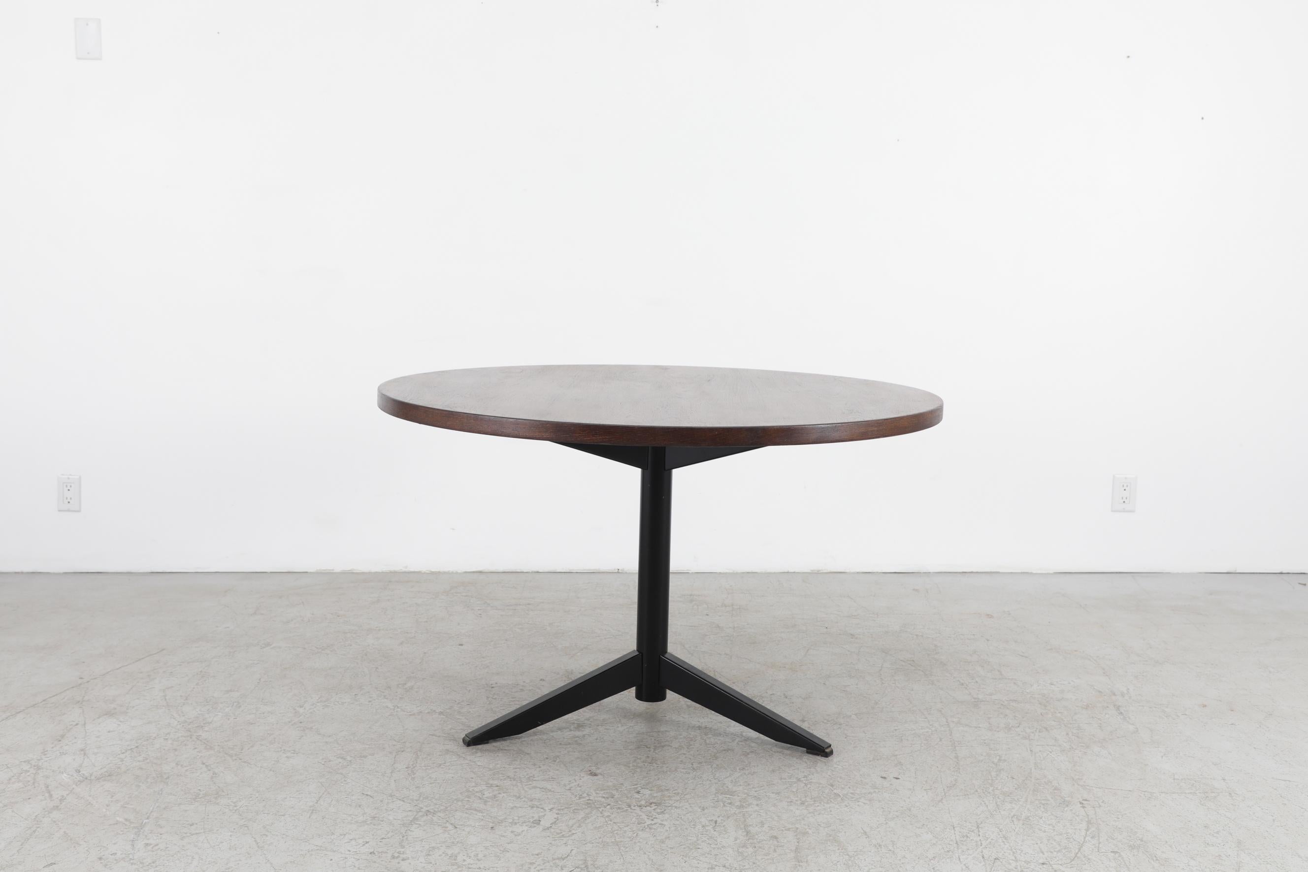 Designed by Martin Visser for 't Spectrum in 1960, the Model TE06 is a timeless design: A minimalist wenge dining table with black pedestal base where Visser's wish to make accessible furniture with as little material and as simple shapes once again