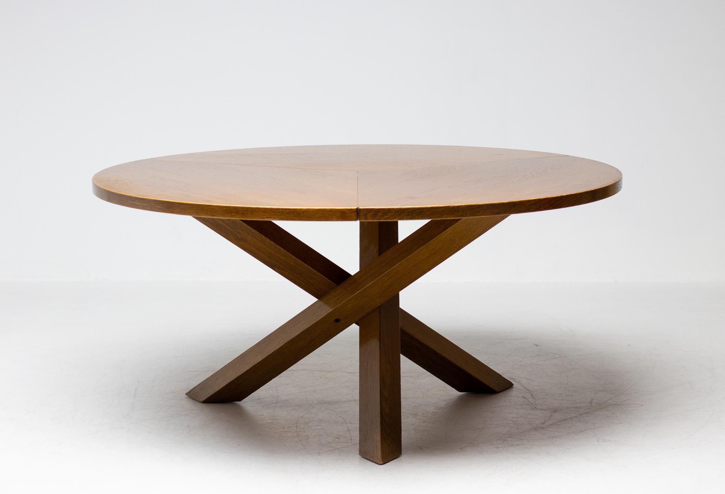 Dark stained oak dining table by Martin Visser for 't Spectrum, the Netherlands.
The oak top consists of three attached segments, and rests on a base of crossed solid oak beams.
This spectacular Martin Visser table was designed at the same time as