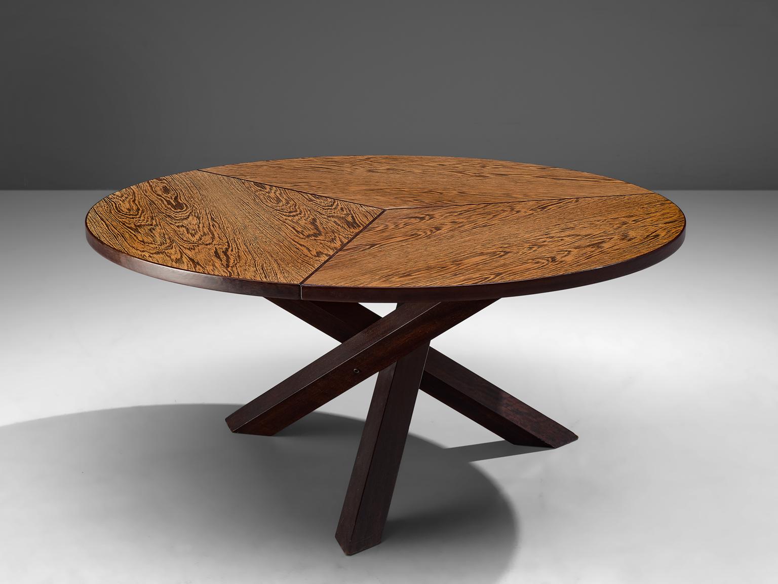 Martin Visser for 't Spectrum, dining table, in Wenge´ and wood, the Netherlands, 1960s.

Beautiful wengé dining table with round top, divided into three parts. The base consist of three crossed legs of solid, darkened wood. The veneer top shows