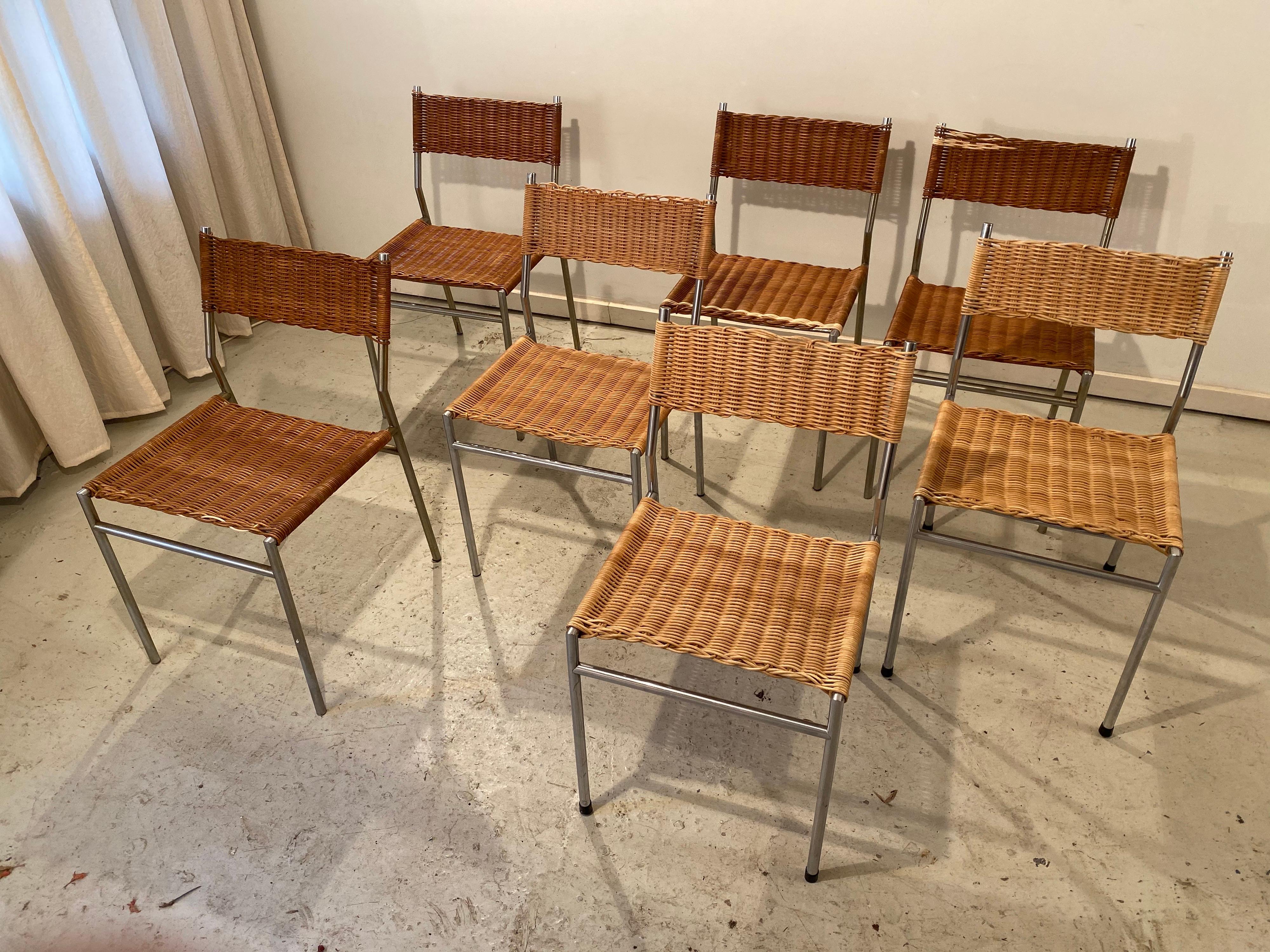 Beautiful wicker dining chairs by famous Dutch designer Martin Visser. Brushed aluminum and wicker seats. Wicker damages have been repaired professionally. The color difference between the new and original wicker disappear over time. Price is per