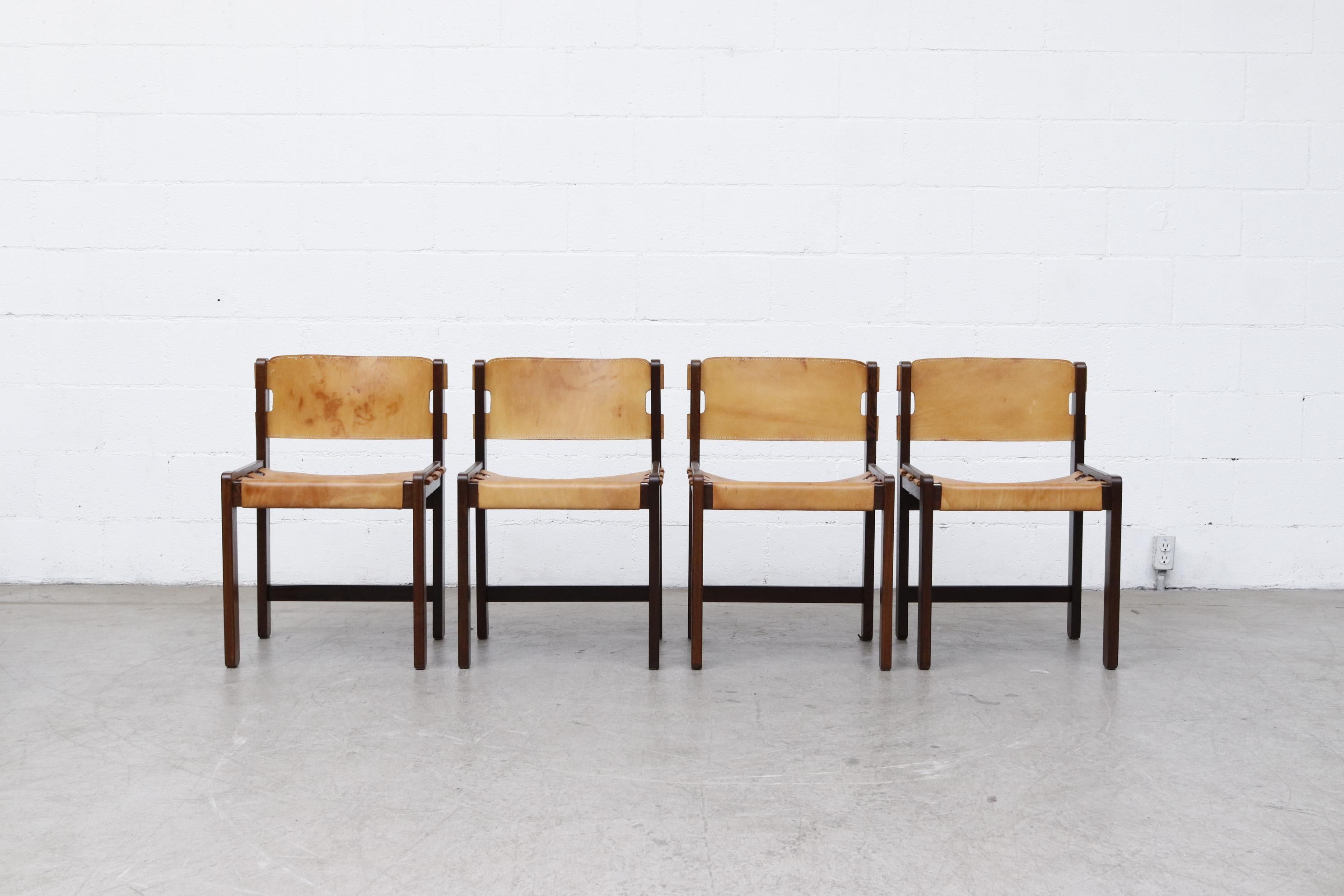 Gorgeous set of 4 Martin Visser leather dining chairs. Heavy Wenge frame with sling leather seating. Striking mid-century design, in original condition with visible wear and patina. Wear is consistent with age and use. Seat measures 17.375 x 14.5.