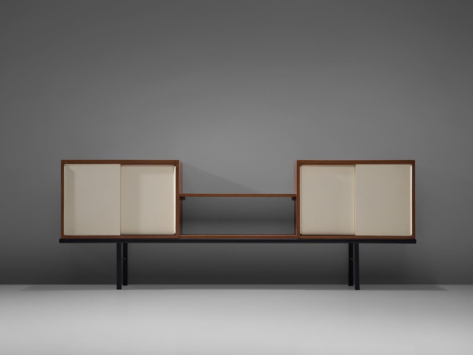 Martin Visser for 't Spectrum, pair of sideboards, Bornholm collection KW63, wood, metal, glass, The Netherlands, 1956-1959

This rare sideboard is executed in mixed materials. The credenza features a Minimalist black metal base and two cabinets