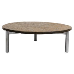 Mesa de centro redonda con tapa de piedra natural y base cromada, estilo Martin Visser