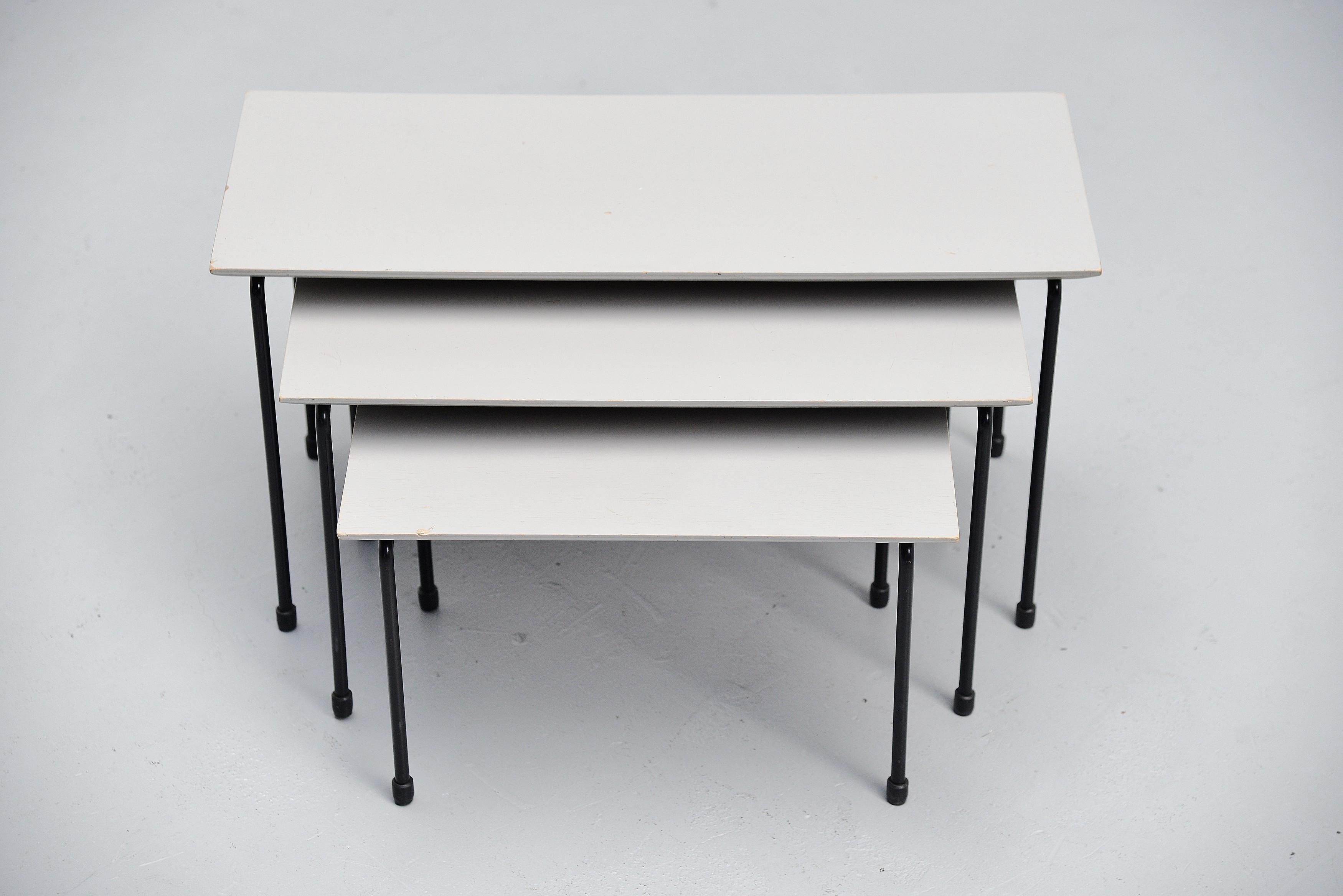 Rare modernist nesting table set designed by Martin Visser and manufactured by 't Spectrum, Holland 1956. This rare nesting table set is from the first production in 1956, it was only produced until 1957. The tables have very nice grey painted
