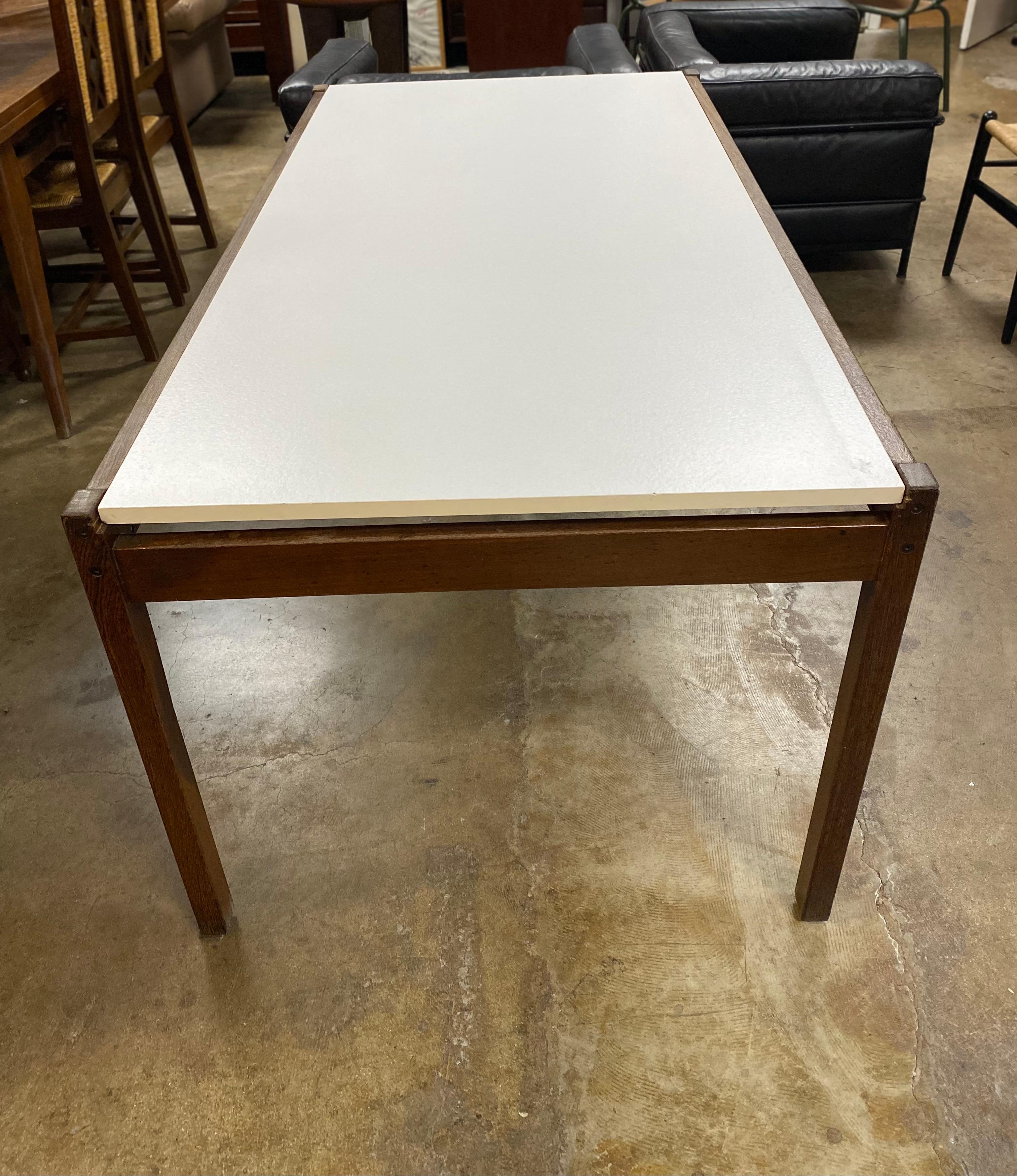 Dutch mid-century modern wenge wood rectangular table with formica top designed by Martin Visser for 't Spectrum, circa 1960s. This Scandinavian modern table features a pull out leaf. There is some wear on wood that is consistent of age and use.