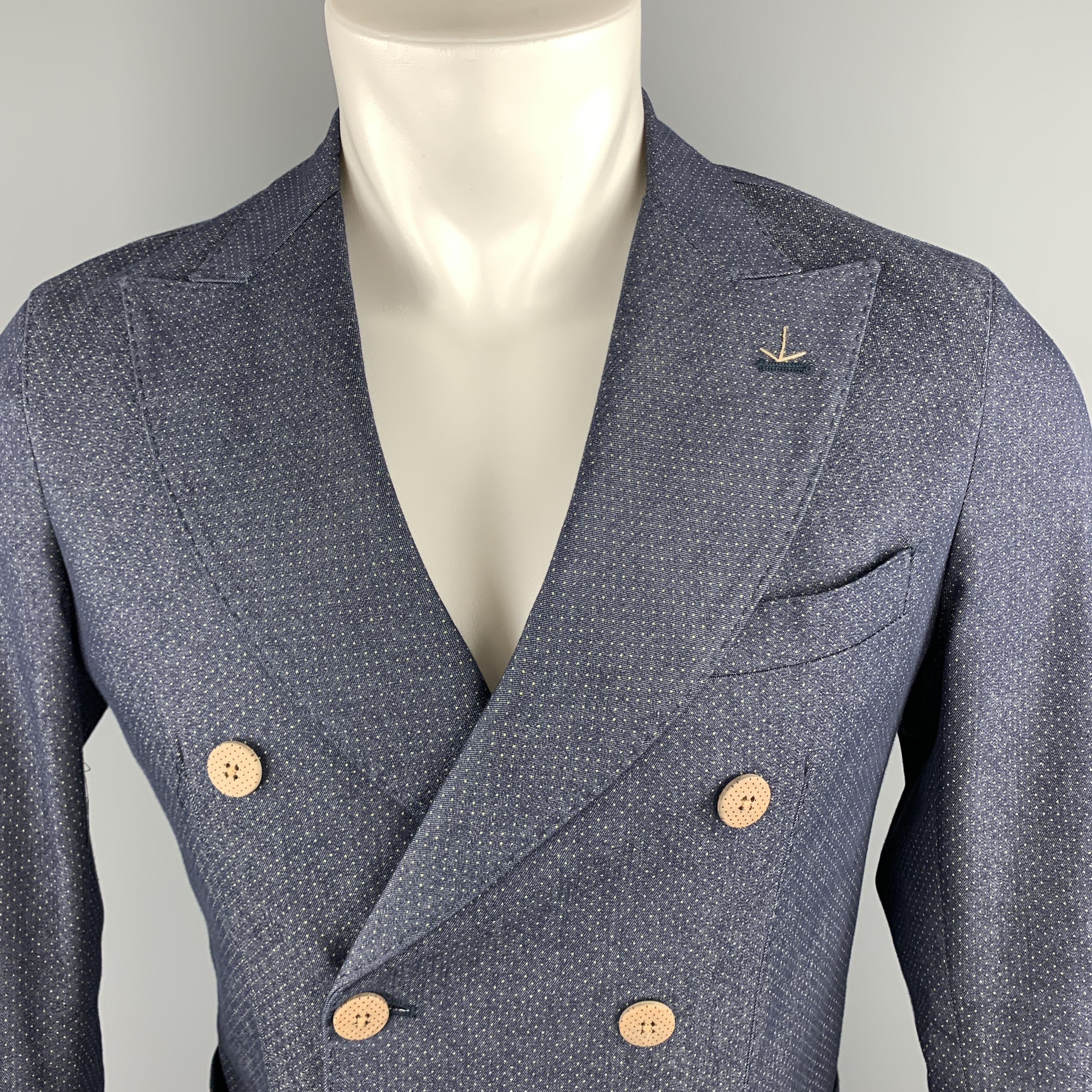 MARTIN ZELO sport coat comes in blue spotted cotton blend material with a peak lapel, double breasted, two button front, and mock button cuff. Made in Italy.

Excellent Pre-Owned Condition.
Marked: IT 46

Measurements:

Shoulder: 16 in.
Chest: 38