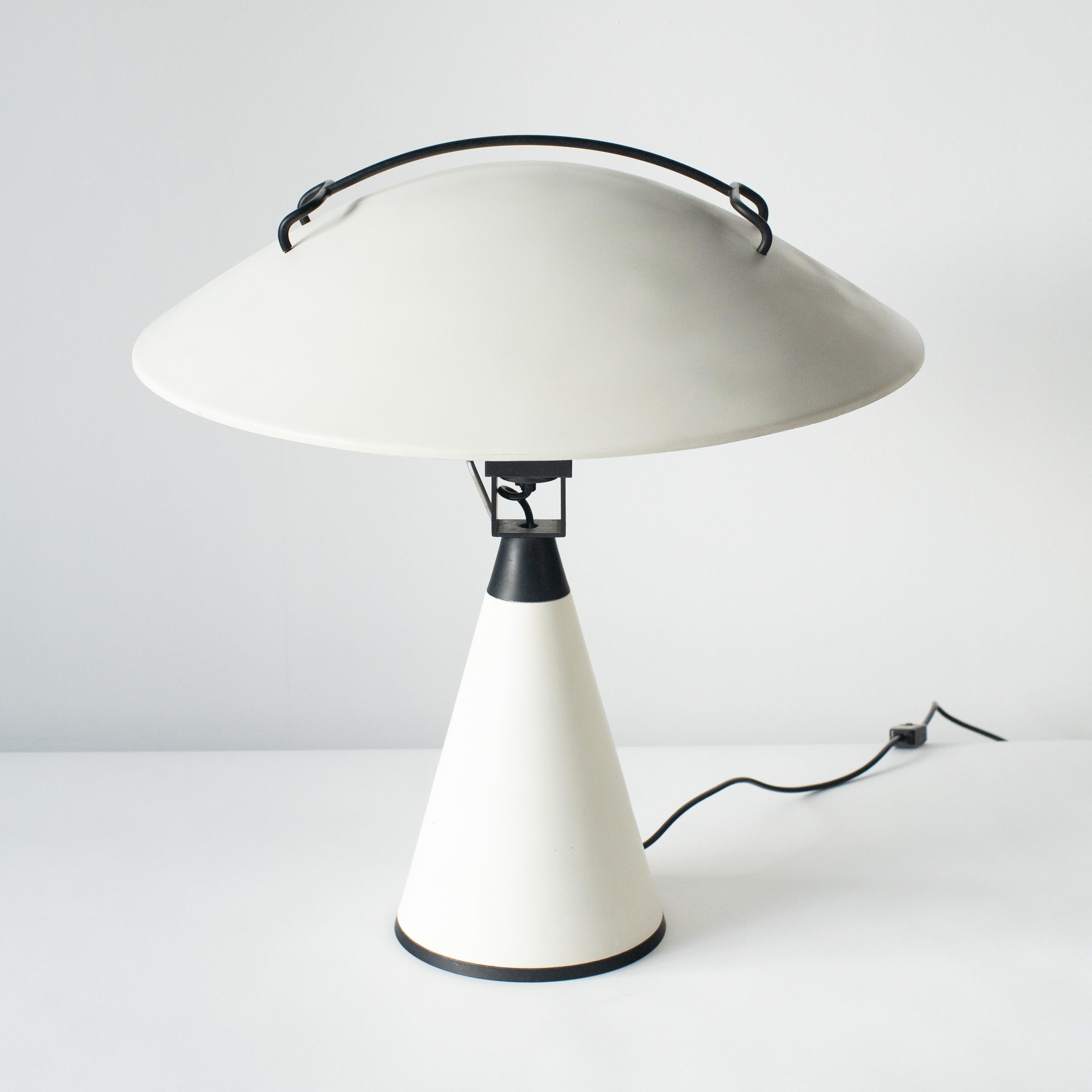 Table lamp designed by Elio Martinelli. Produced by Martinelli Luce. Probably in the 70s or 80s. 
Made steel. Lamp shade can be tilted. Tilted shade looks like radar. So, it is called radar lamp. 

E27 light bulb.
using with 100-120V Able to use in