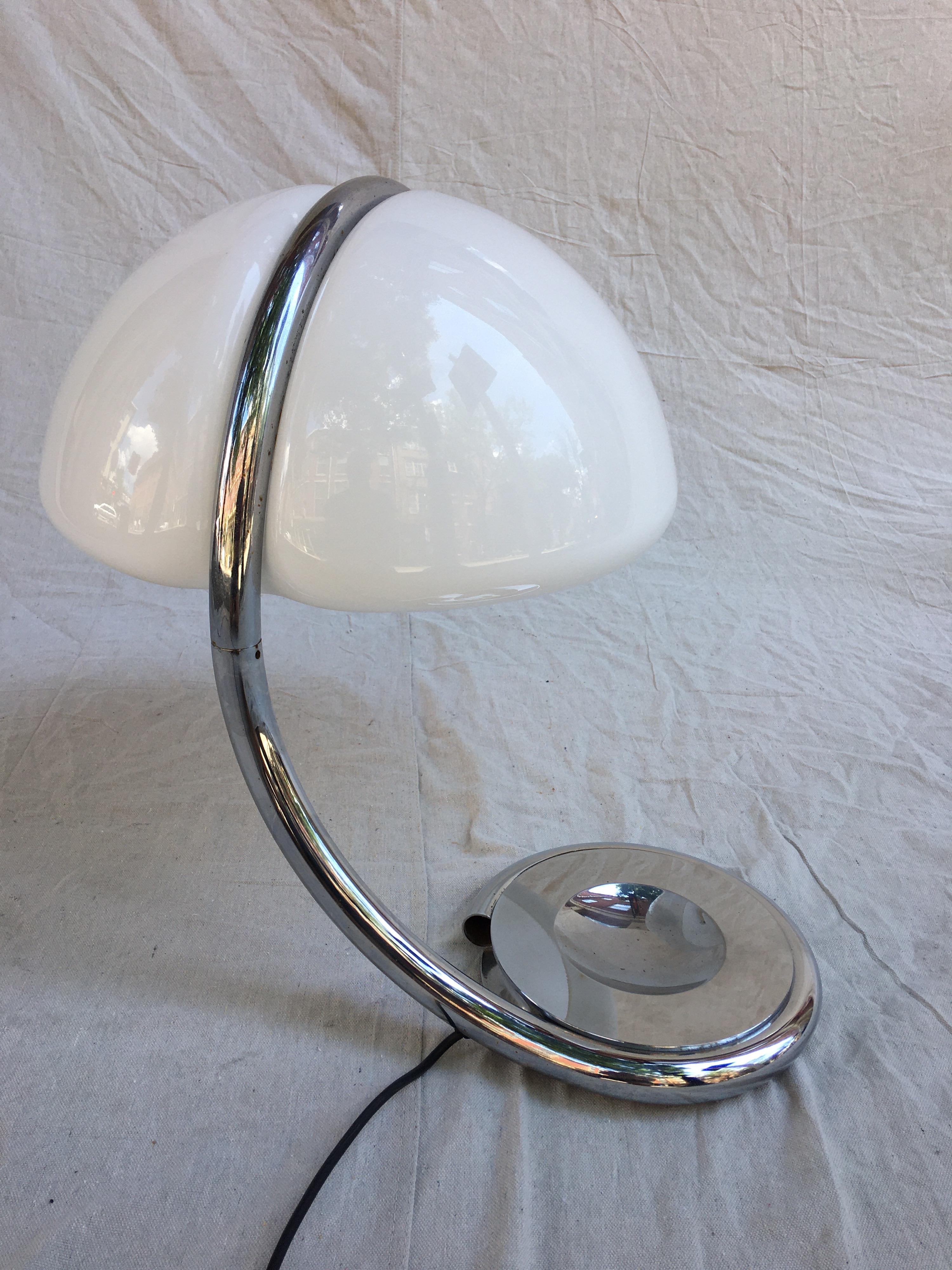 Martinelli Luce serpente table lamp. Shade swings slightly to place light where needed. Chrome neck forms from the base and fades into plastic shade. Switch on line.