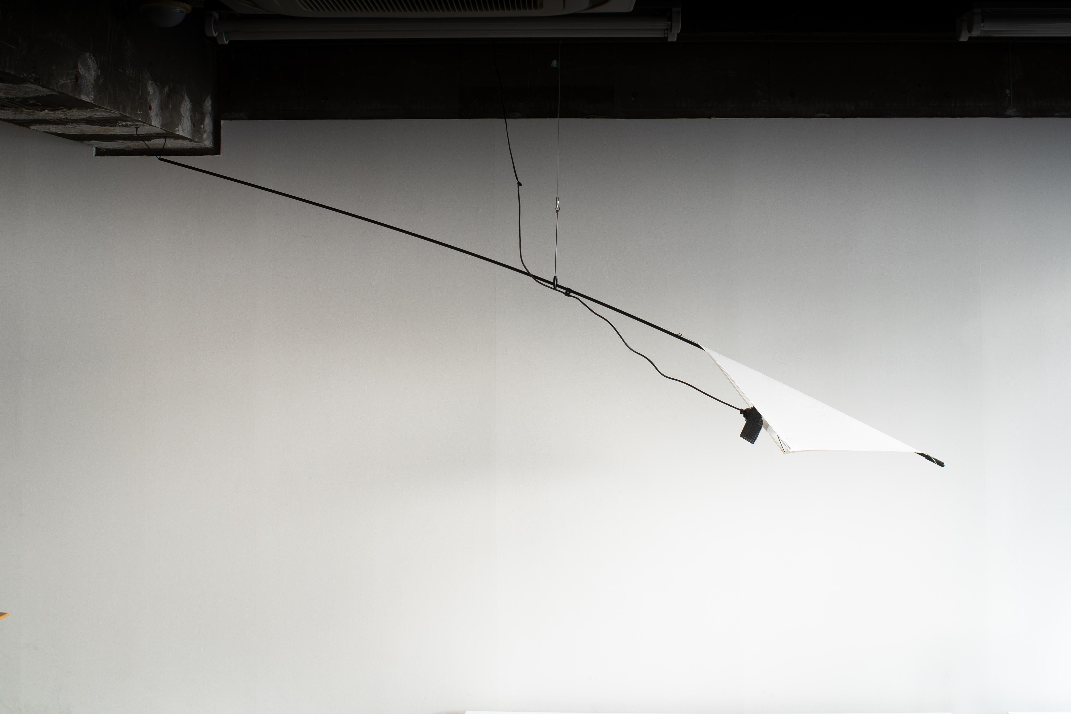 Sculptural hanging light designed by Paolo Orlandini in 1980. Produced by Martinelli Luce.  
As changing position of the supporting ring and main rod, Position of the shade is changed. Please see images. Shade is white cotton fabric. 

E27 light
