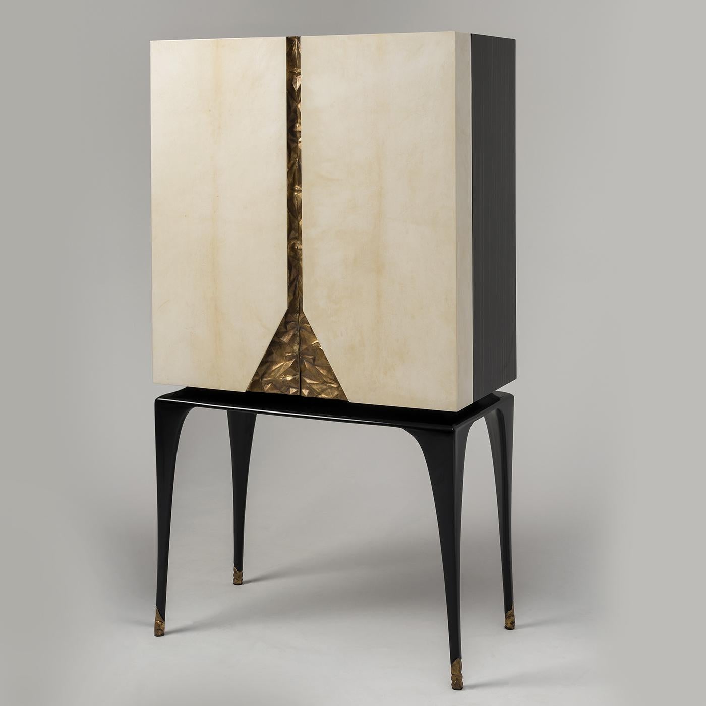 Stunning and brimming with style, the Martini Bar cabinet in Macassar ebony features glossy streaks in shaded orange, legs in black lacquered wood, doors in antique-looking polished ivory-colored parchment and detail in gold leaf, etched by hand.