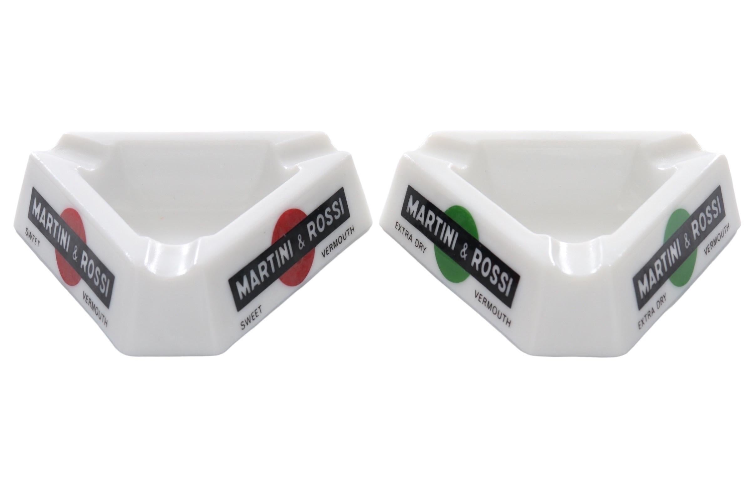 A pair of French Martini & Rossi triangular ashtrays. White opalex is branded Martini & Rossi Extra Dry and Sweet Vermouth on each side. Each corner has a beveled cigarette rest. Marked “Made in France, Renfield Importers, New York, NY” underneath.
