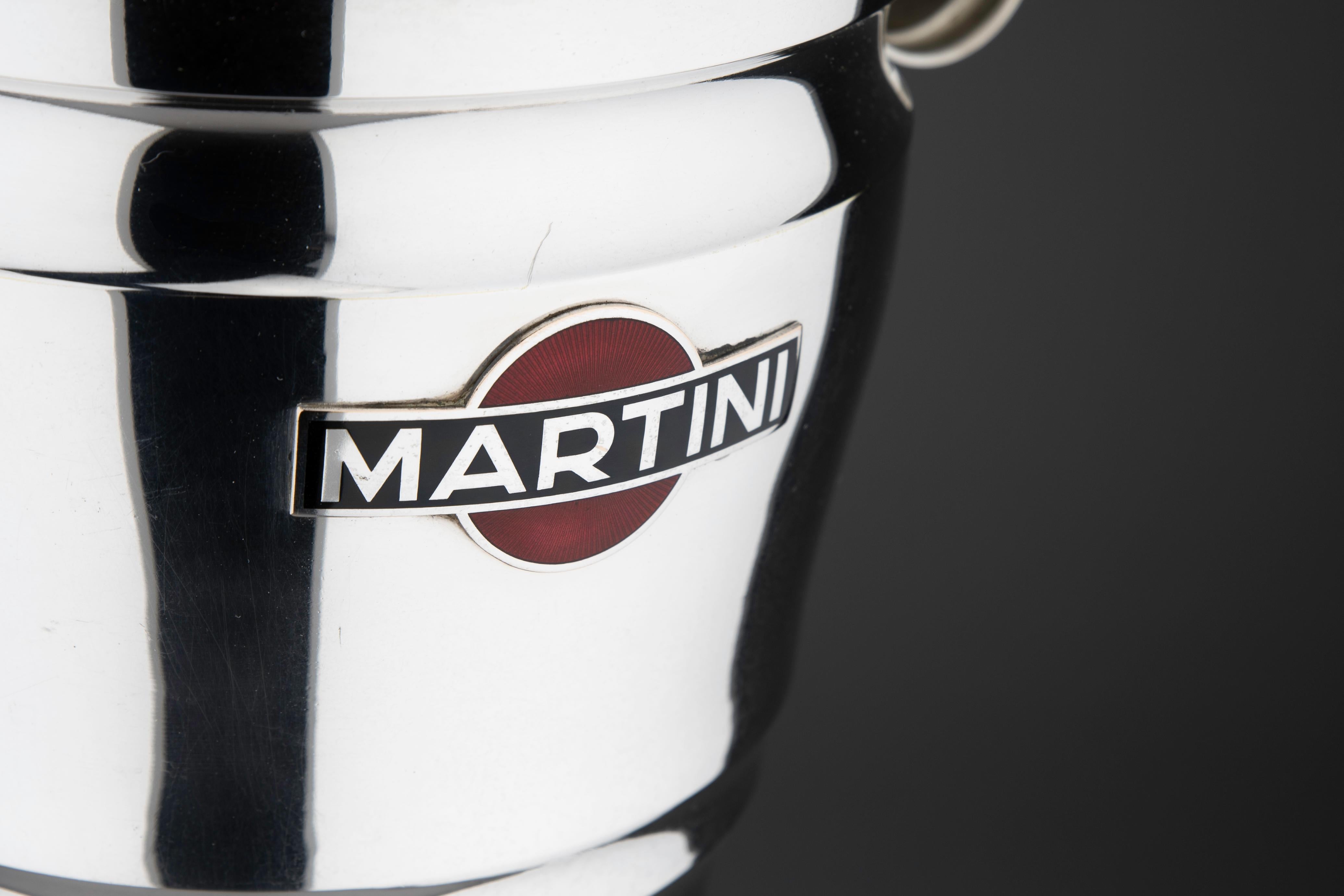 Elevate your entertaining experience with a touch of vintage elegance and iconic style. Presenting a stunning 1960s silver-plated martini champagne cooler that embodies the epitome of sophistication and timeless design.

This exquisite cooler