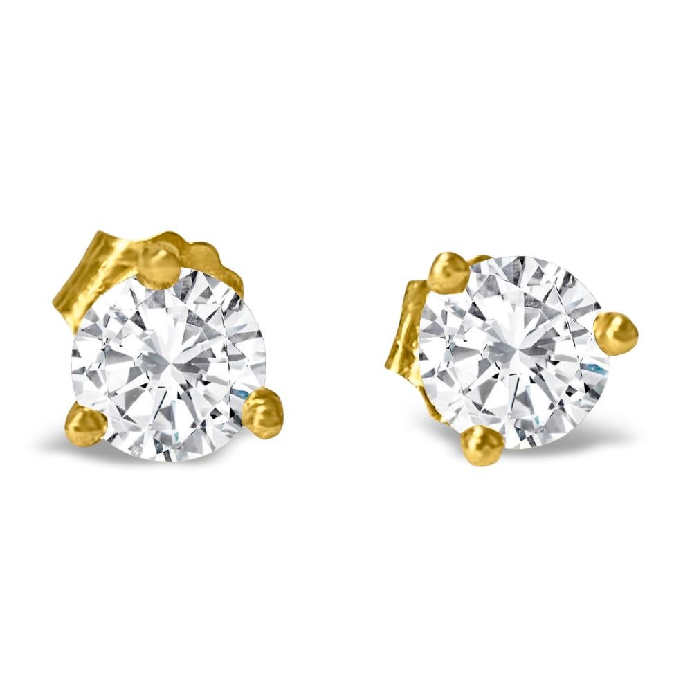 Fashioned from lustrous 14k yellow gold, these unisex diamond studs feature dazzling 4mm round brilliant cut diamonds with a total weight of 0.50 carats. Showcasing VVS-VS clarity and H-I color, these diamonds sparkle with unparalleled brilliance.