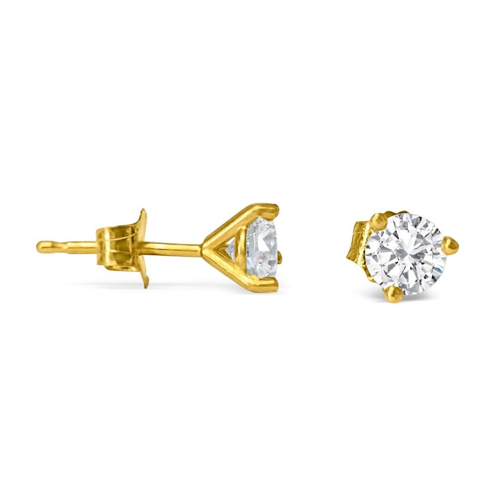 Crafted from stunning 14K yellow gold, these unisex diamond studs feature dazzling 5mm round brilliant cut diamonds totaling 1.00 carat. With VVS-VS clarity and H-I color, these natural earth mined diamonds are set in a classic 3-prong martini