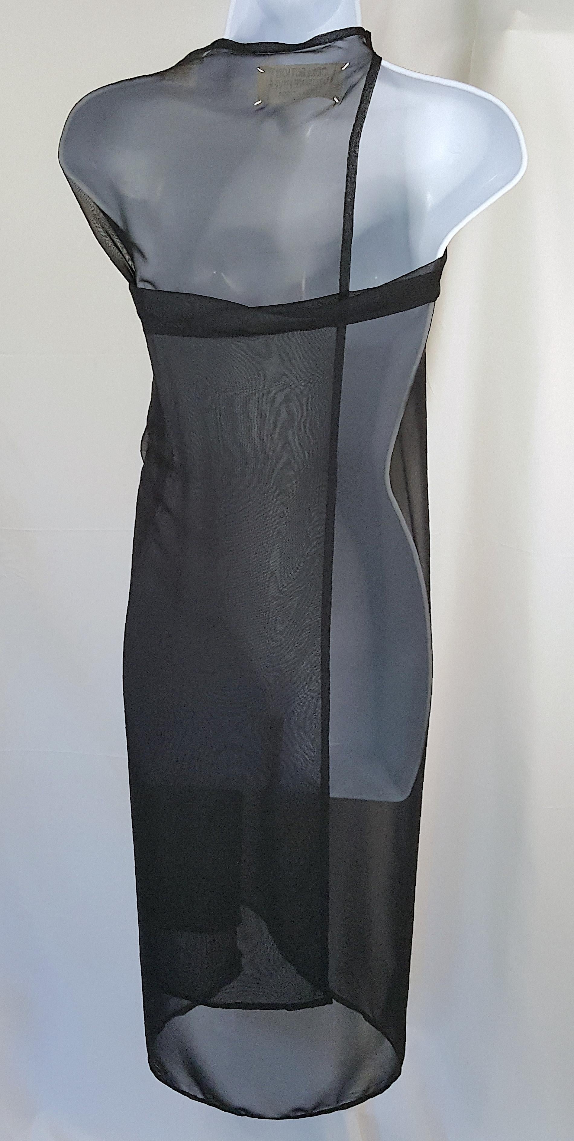 Dating this minimalist convertible transparent black chiffon rectangular garment by Belgian former fashion designer Martin Margiela to Spring 1994 among his many variations of the traditional waiter-style apron that he reworked with his eponymous