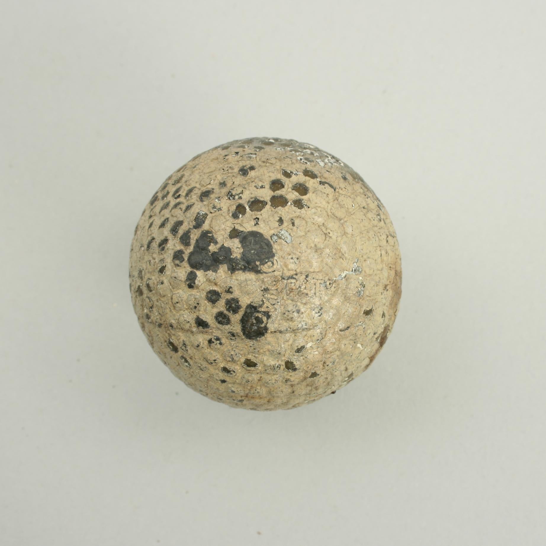 Martins Bramble 'Zodiac' Golf Ball.
A good example of a 'Zodiac' bramble patterned rubber core golf ball. The golf ball is in fair condition and is manufactured by Martins, England, circa 1906. The ball is marked 'Zodiac Pat' on one pole and