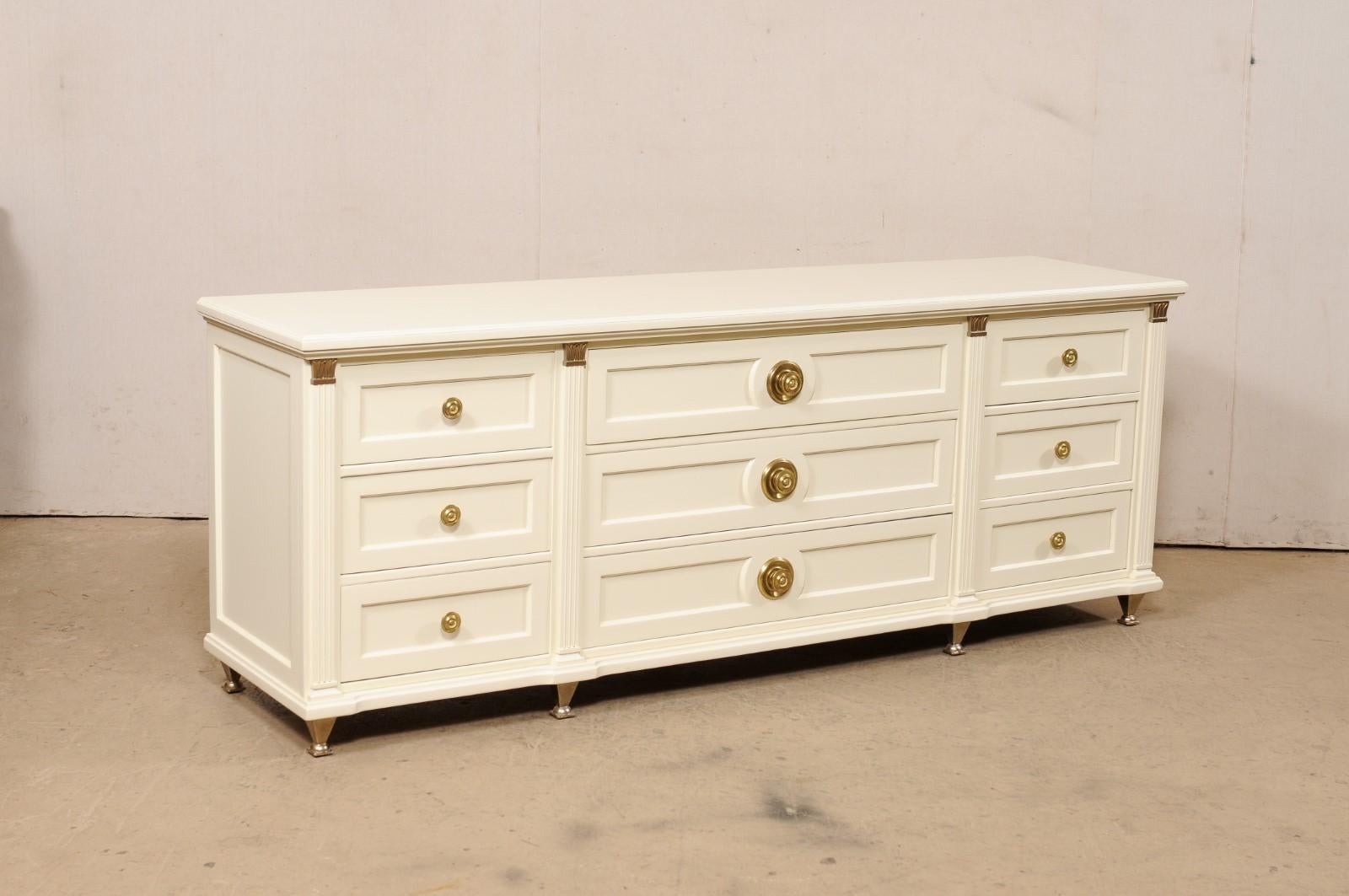 A vintage chest of nine drawers, with new custom ivory finish, by renowned US furniture markers 