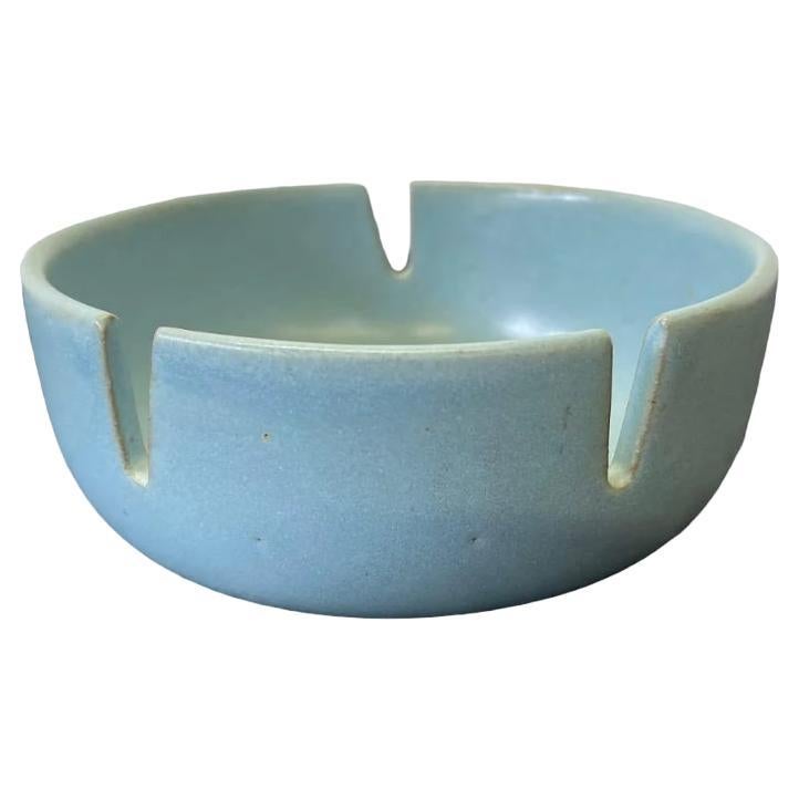 Baby blue glazed stoneware ashtray designed by Gordon & Jane Martz for Marshall Studios. The rarely found model CN notched ashtray features a matte glaze in their gorgeous light blue shade #21 with hand incised flowers. Use it as intended and as a