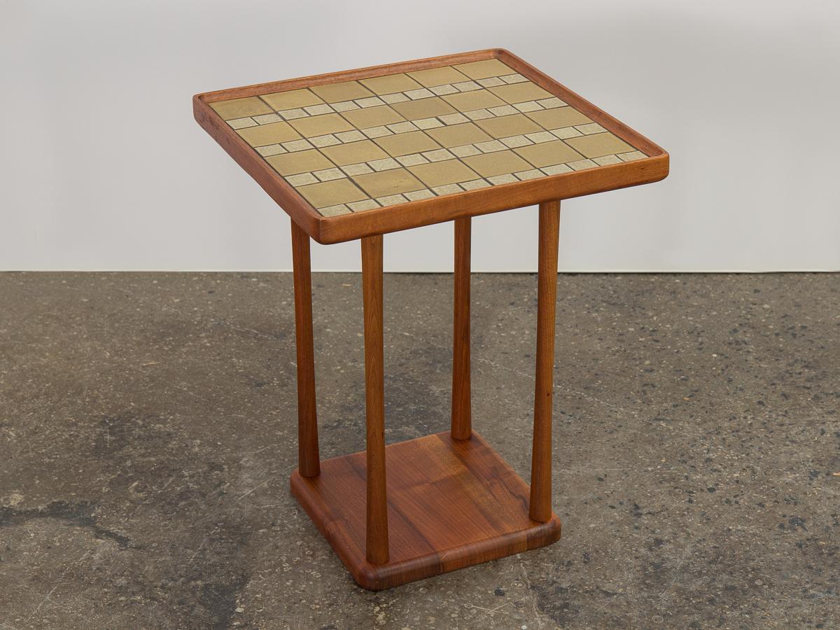 Ceramic tile top square occasional table, designed by Jane and Gordon Martz for Marshall Studio. Signature inlaid ceramic mosaic with contrasting golden yellow and cream tiles on minimal walnut wood form. Seldom seen in this square silhouette, this