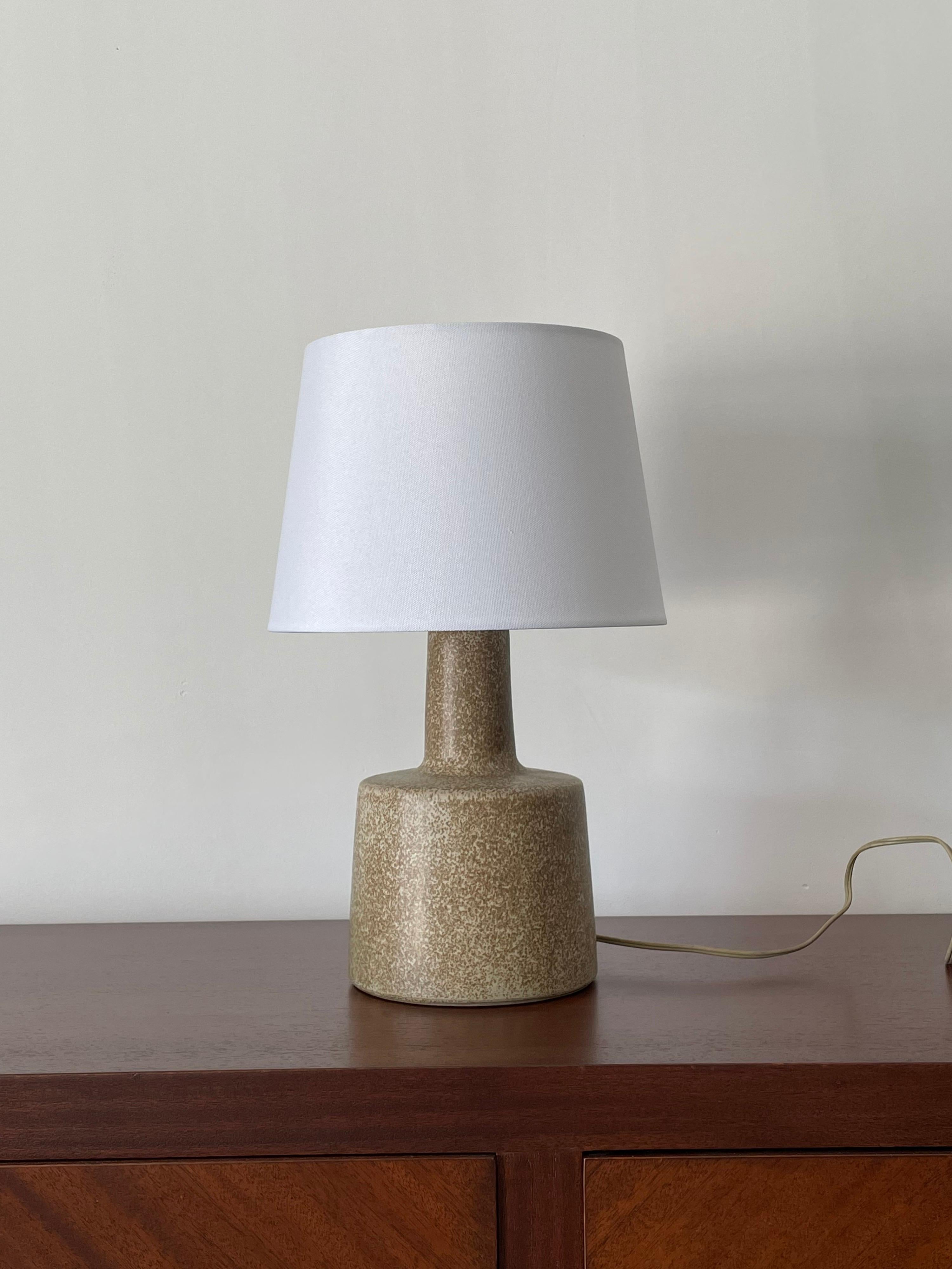 Table lamp designed by ceramicist duo Jane and Gordon Martz for Marshall Studios. Wonderful organic color palette with a sand base and tan speckles.

Dimensions
15.5” tall 
 10” wide 

Ceramic portion only 
9” tall 
6” across.