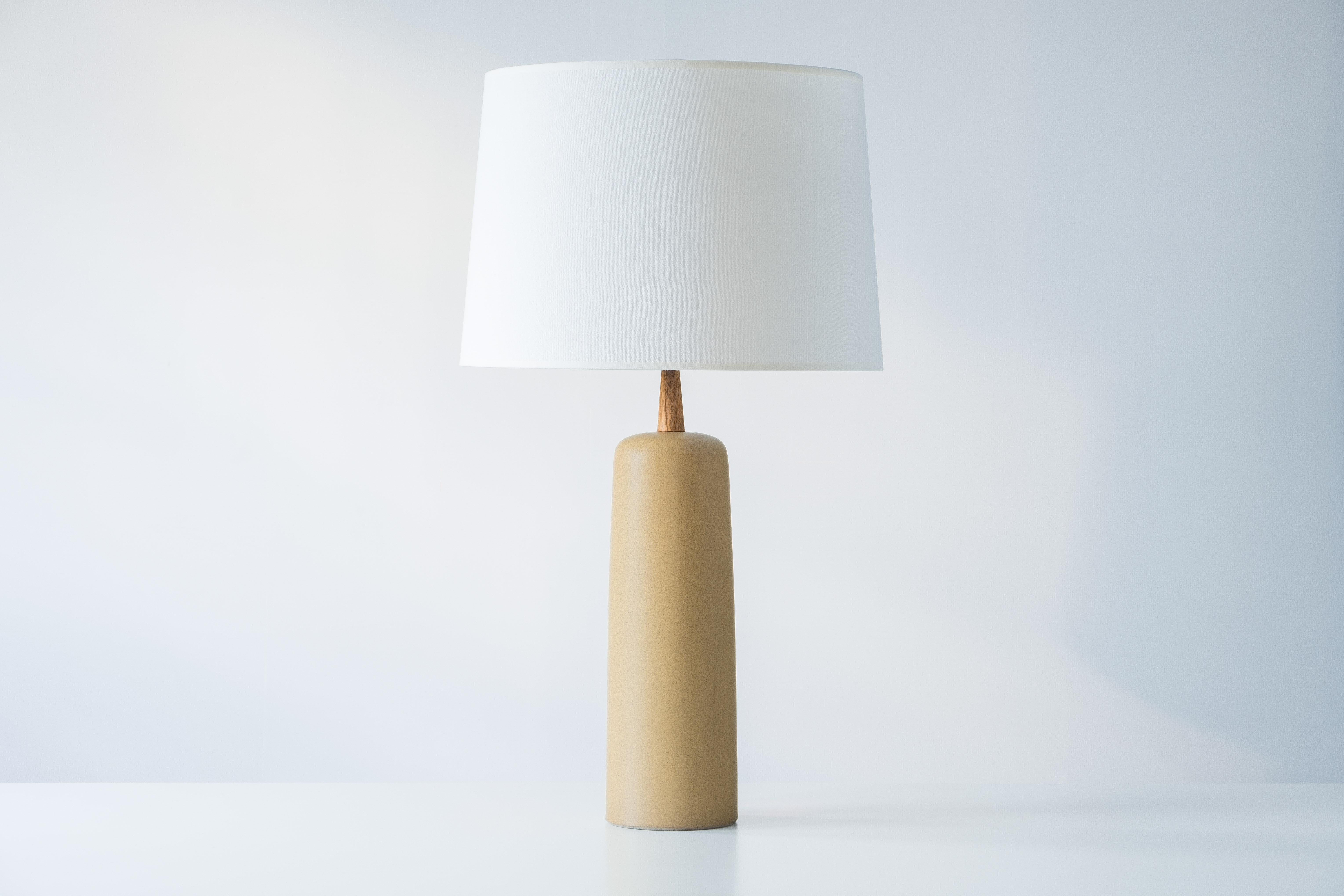 WHAT IS IT?
—
This signed Martz Model 41 lamp comes in a matte yellow ochre glaze. The overall color tone is hard to pin down, but let's call it 