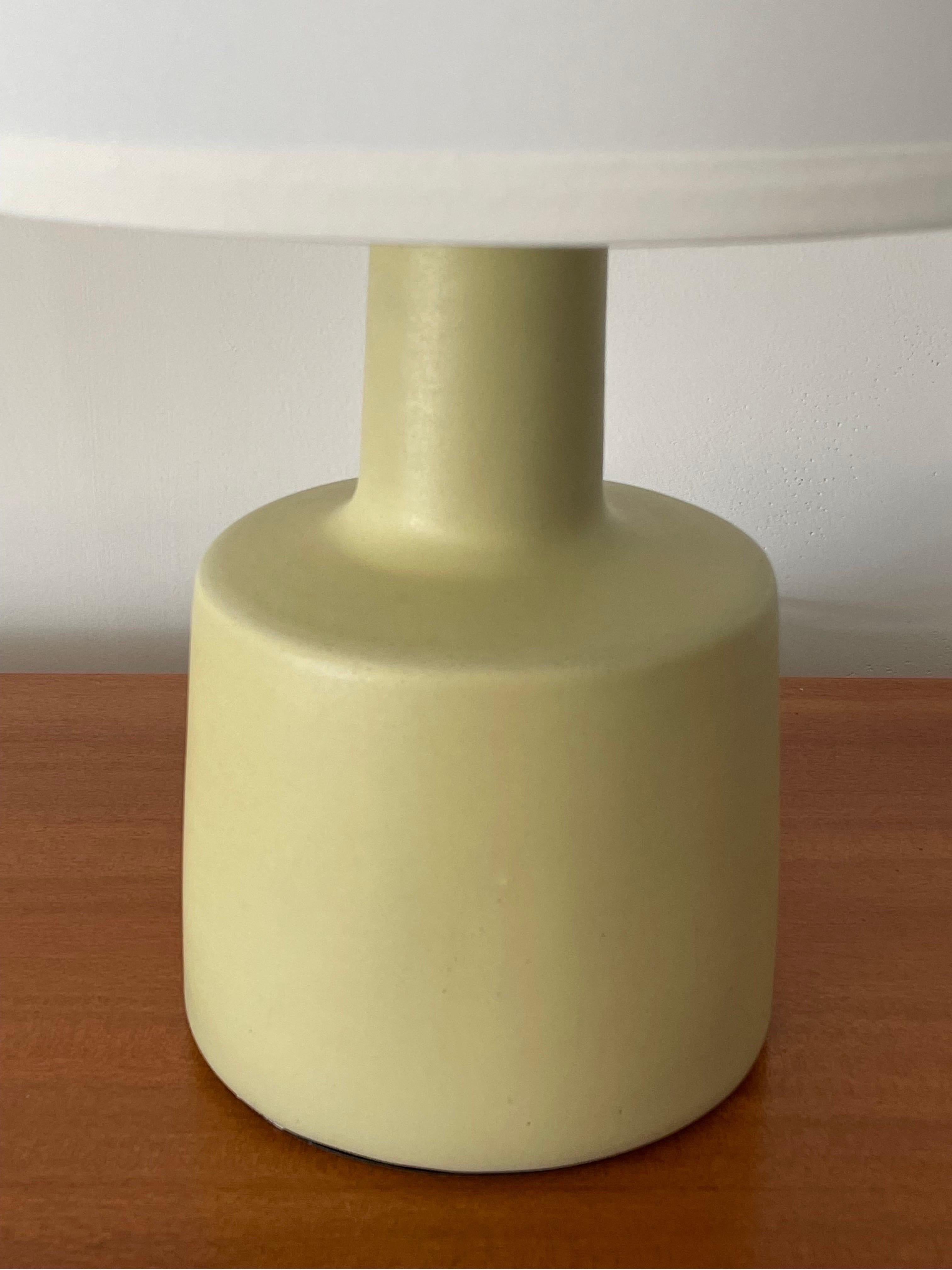 Table lamp designed by famed ceramicist duo Jane and Gordon Martz for Marshall Studios. Great pale/ lemon yellow in a flat or matte glaze.

Overall:
19” tall
13” wide

Ceramic:
9” tall
6.25” wide.